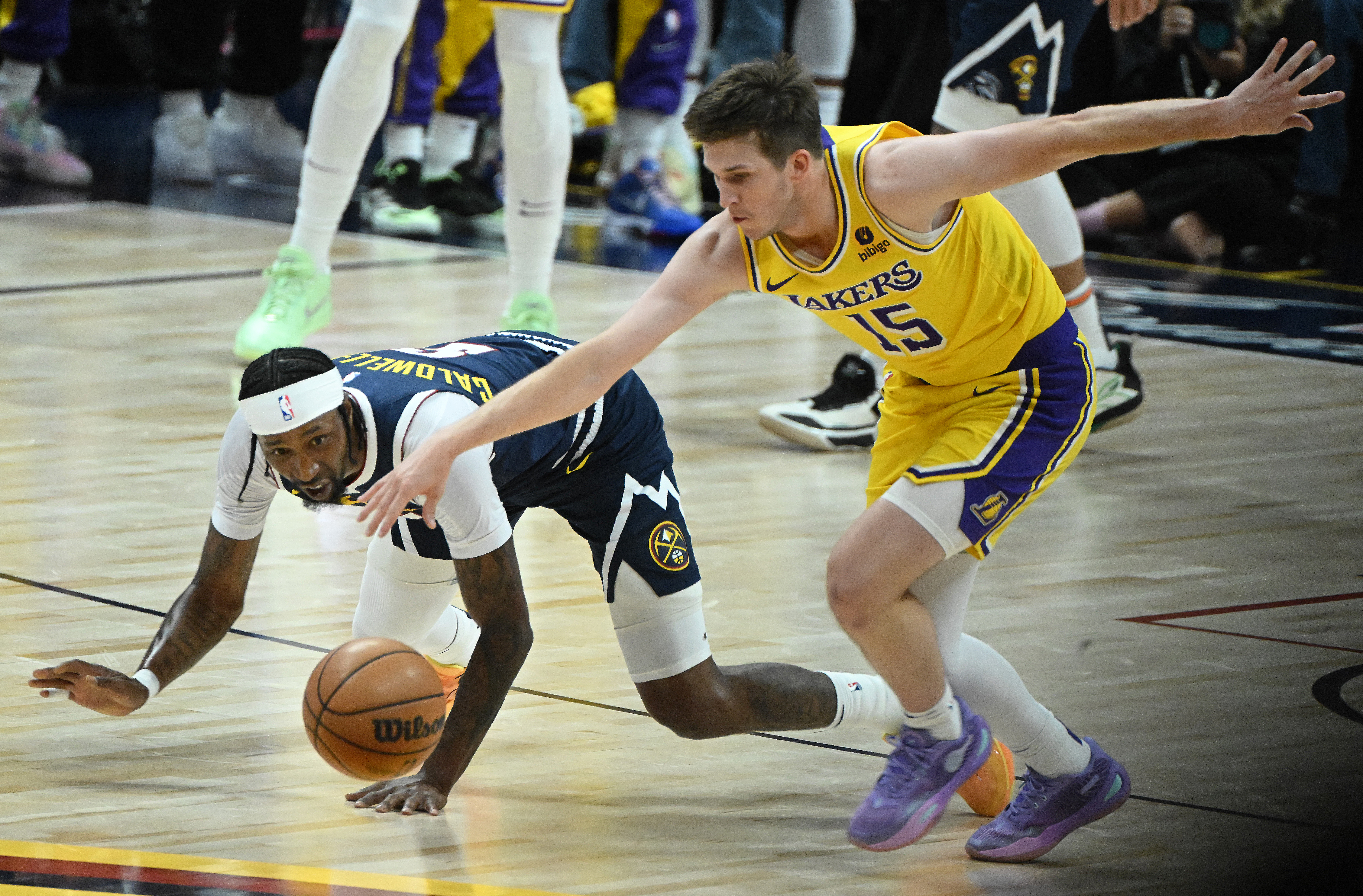 Kentavious Caldwell-Pope and Lakers’ Austin Reaves scramble for the ball during game 5 of the first round of the Western Conference championships at Ball Arena on Monday, April 24, 2024. The Nuggets won the game 108-106. (Photo by Jerilee Bennett, The Gazette)