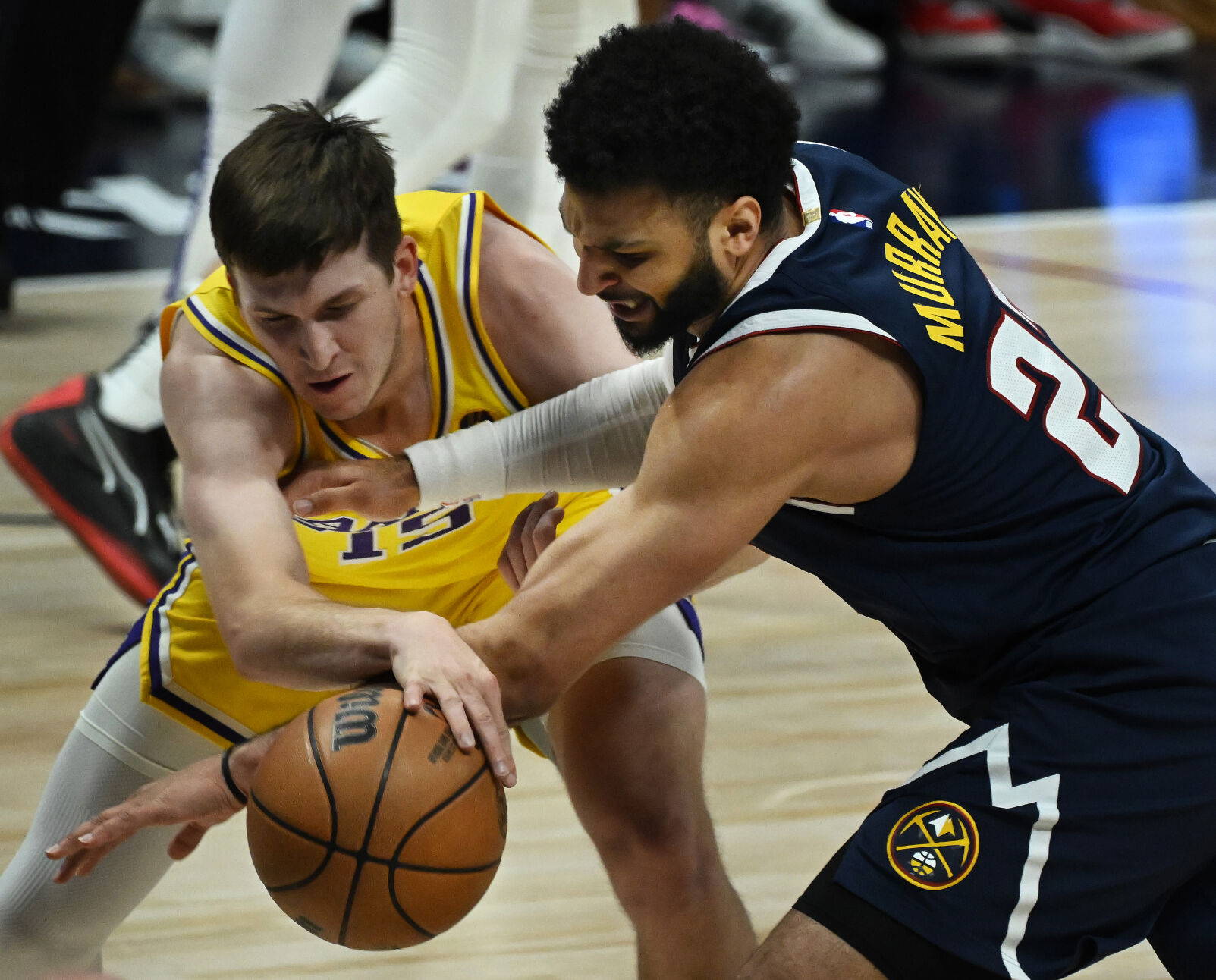 Jamal Murray steals the ball from Lakers’ Austin Reaves right under the Lakers basket during the first quarter of game 5 of the first round of the Western Conference championships on Monday, April 29, 2024. (Photo by Jerilee Bennett, The Gazette)