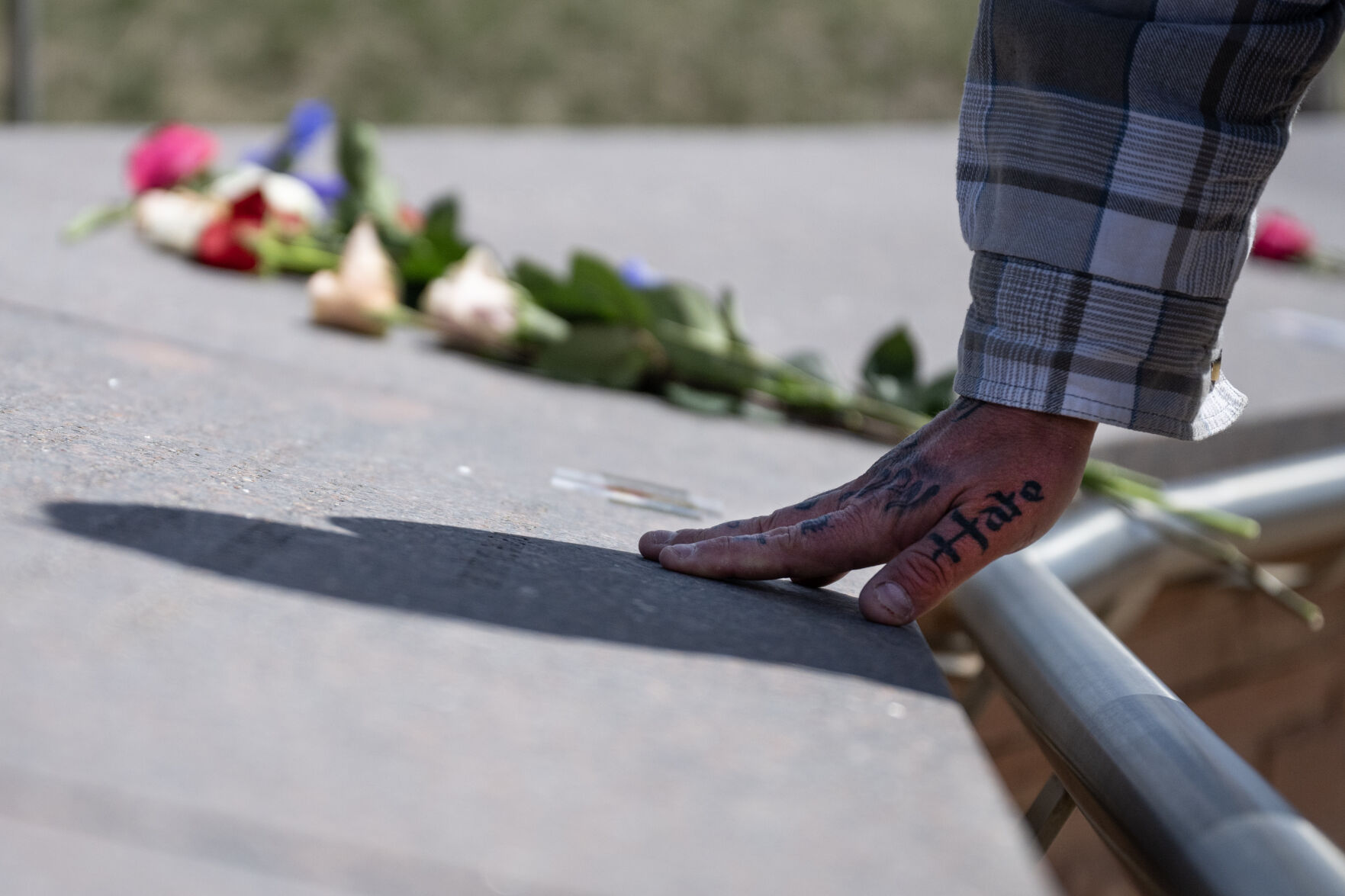 FILE PHOTO: Will Saggau, a 2001 graduate of Columbine High School who was present during the 1999 mass shooting, places his hand down at the the Columbine Memorial on Thursday, April 20, 2023, in Robert F. Clement Park in Littleton, Colo. (Timothy Hurst/Denver Gazette) (TimHursttim.hurst@gazette.comhttps://secure.gravatar.com/avatar/aca82bd62b4ee425c598527cd6faa1b1?d=mm&r=g)