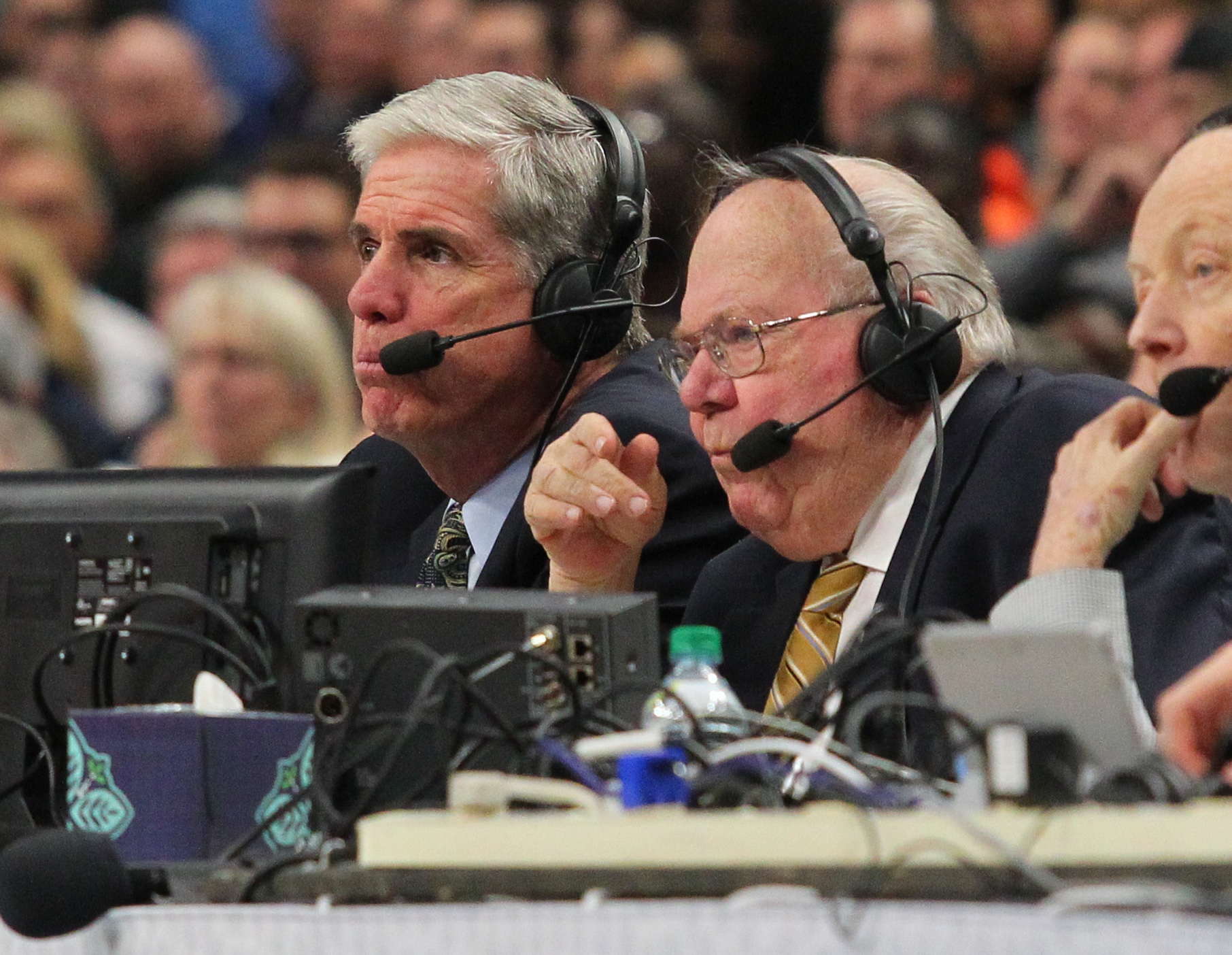 Broadcaster Jim Spanarkel, left, and Verne Lunquist work during the first half of a first-round men's college basketball game between Villanova and Mount St. Mary's in the NCAA Tournament, Thursday, March 16, 2017, in Buffalo, N.Y. (AP Photo/Bill Wippert) (Bill Wippert)