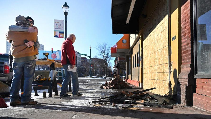 Skirted Heifer owner Kevin Megyeri gets a hug from a friend outside his North Tejon Street restaurant on Sunday morning, Feb. 11, 2024, in downtown Colorado Springs.