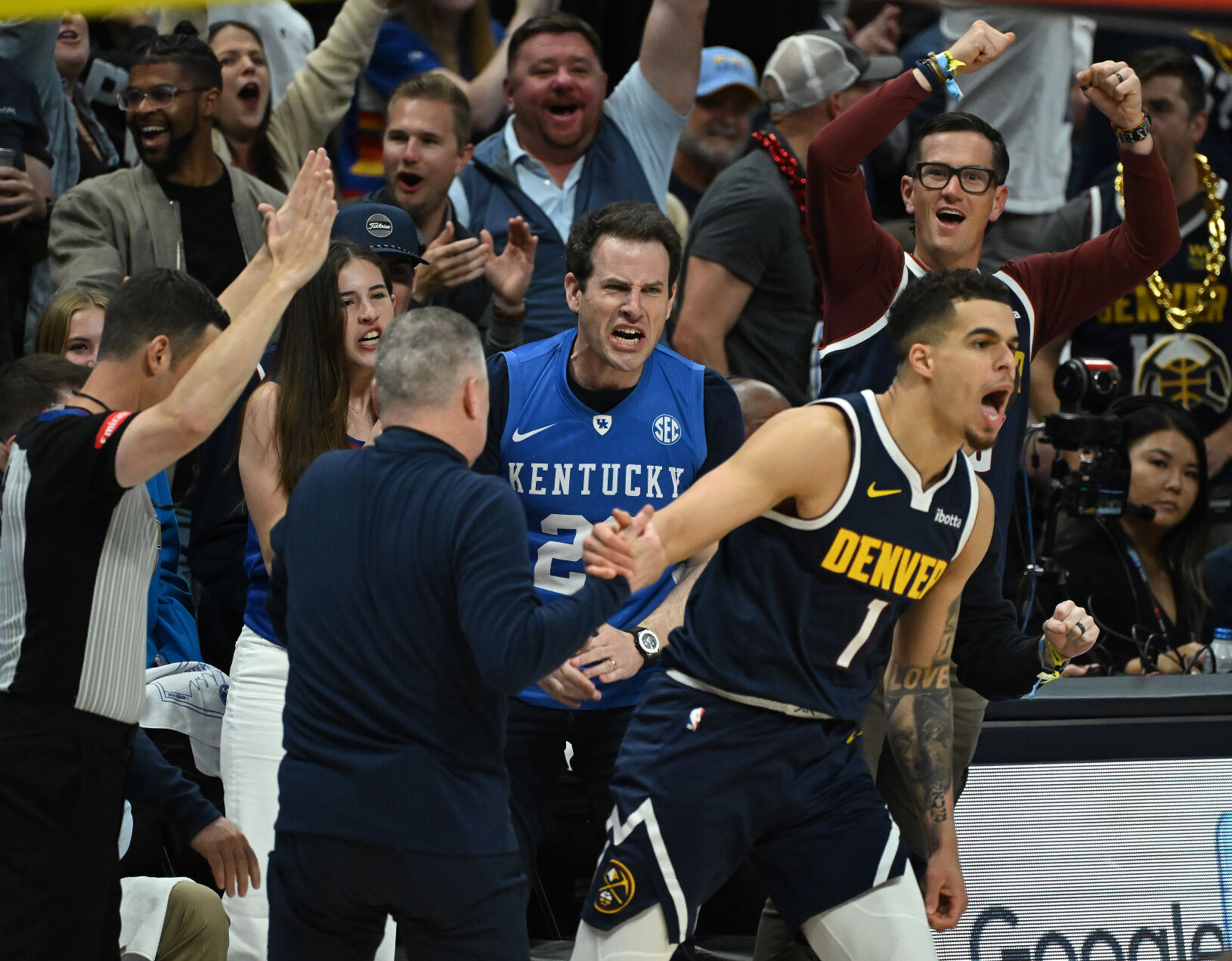 Michael Porter, Jr. celebrates a 3-pointer with Head Coach Michael Malone as the crowd celebrates during the third quarter of game 5 of the first round of the Western Conference championships on Monday, April 29, 2024. (Photo by Jerilee Bennett, The Gazette)