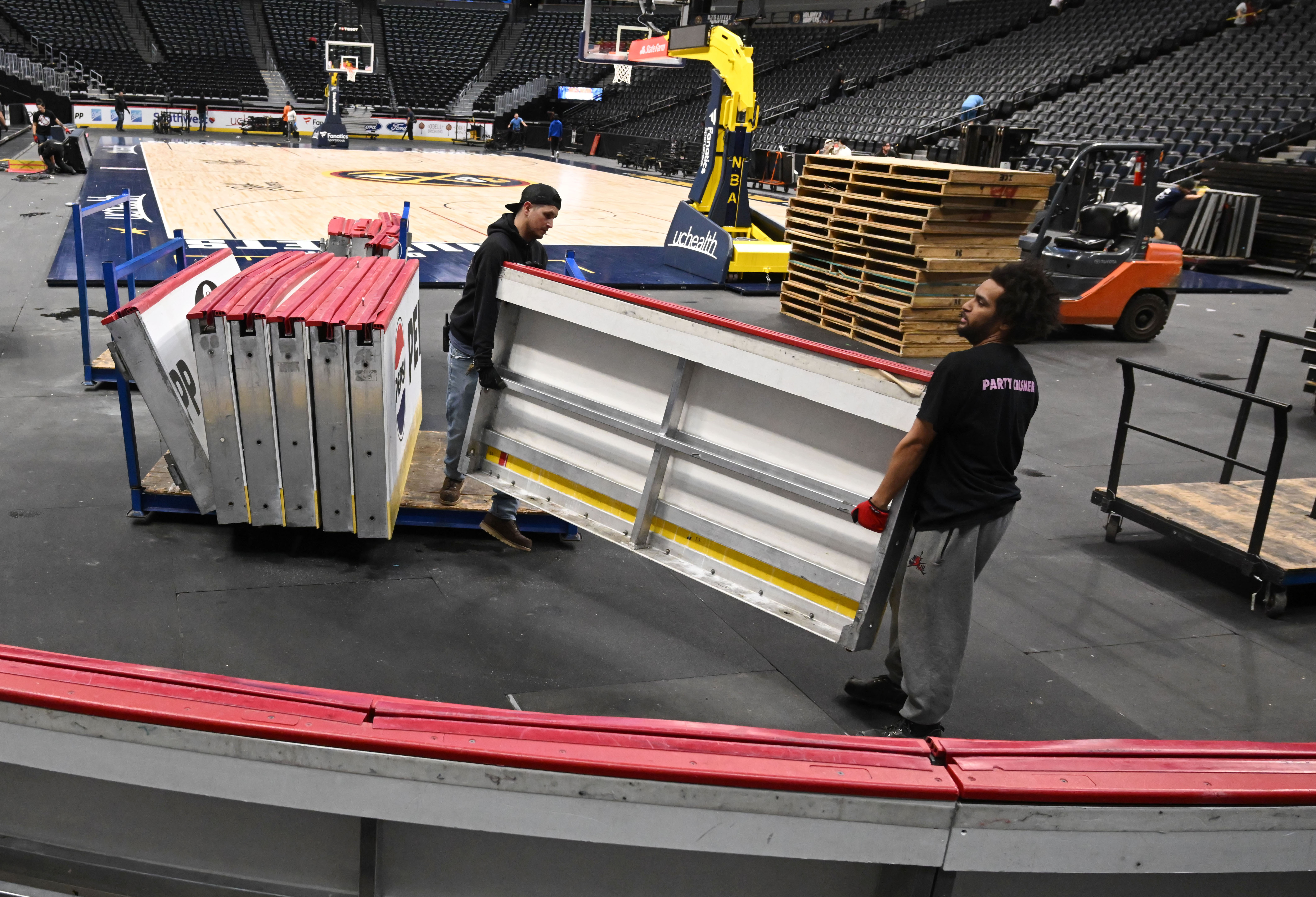The walls of Avalanche ice rink are brought out to put into place. Ball Arena was transformed from Nuggets to Avalanche overnight on Thursday, March 21, 2024. (Photo by Jerilee Bennett, The Gazette)
