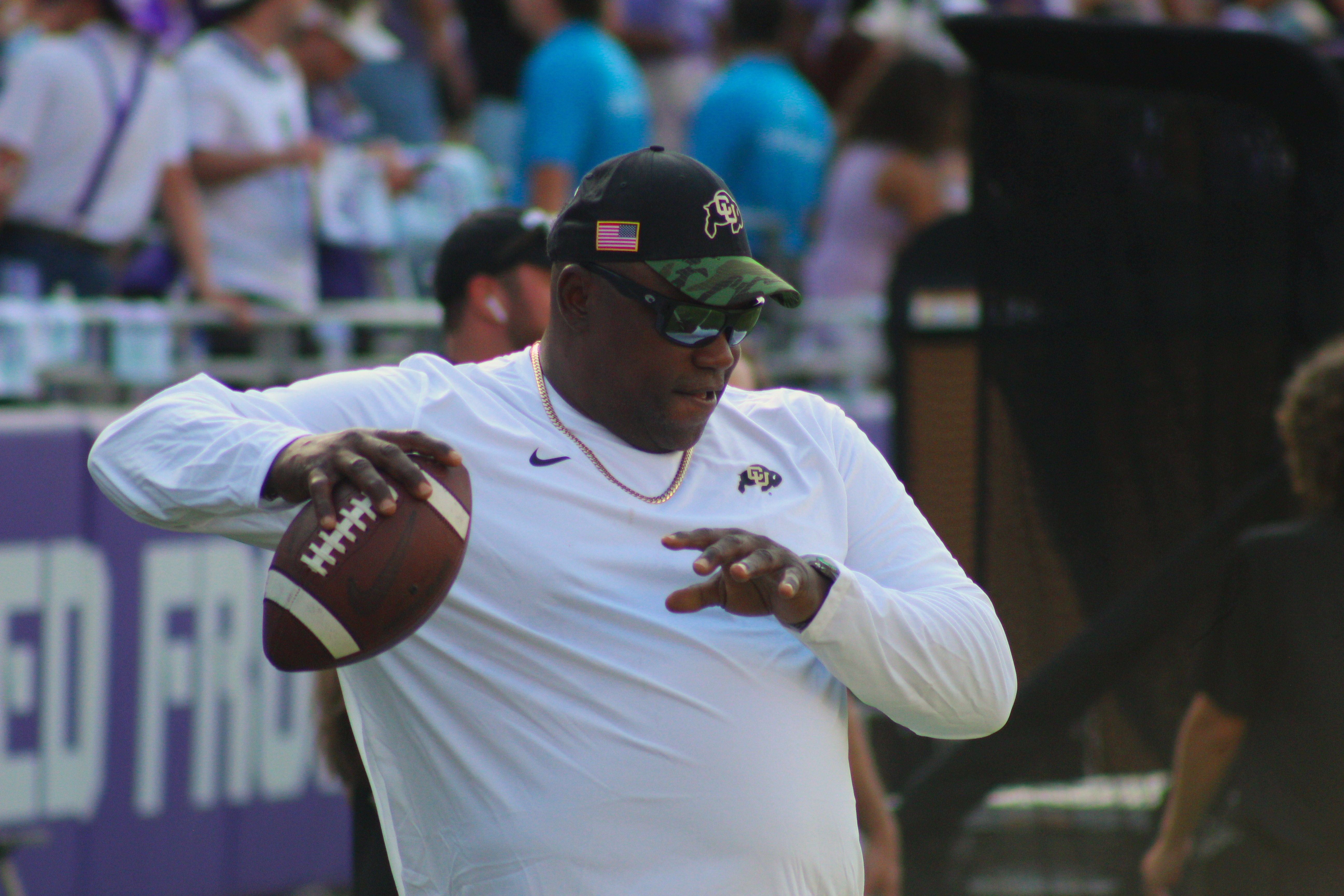 NFL Hall of Famer Warren Sapp throws a football on the field before Colorado's 2023 season opener against TCU on Sept. 2, 2023 at Amon G. Carter Stadium in Fort Worth, Texas. Sapp was officially hired as a graduate assistant on Deion Sanders' coaching staff this spring. (Tyler King, The Denver Gazette)