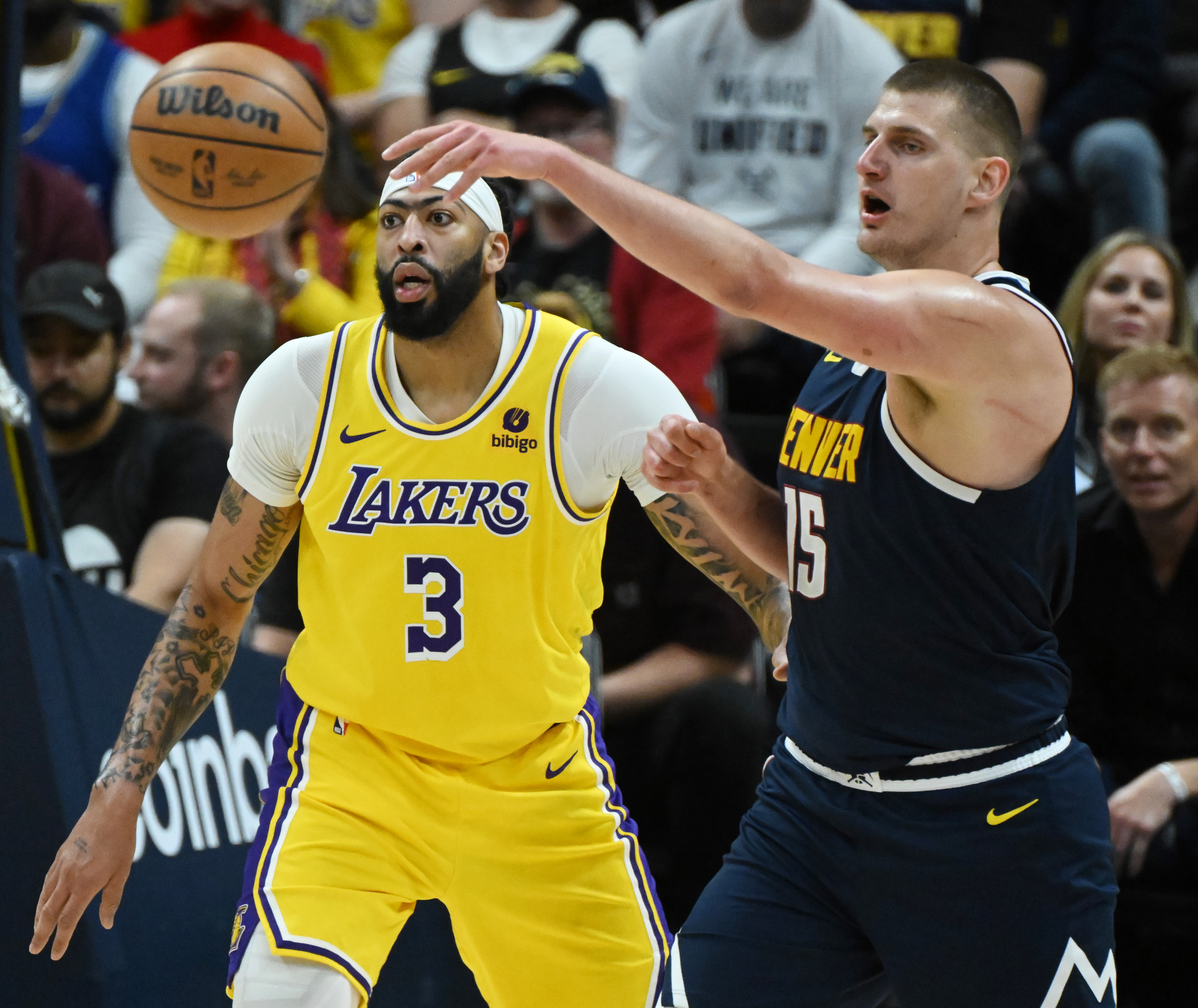 Nikola Jokic passes the ball past Lakers’ Anthony Davis during game 5 of the first round of the Western Conference championships at Ball Arena on Monday, April 24, 2024. The Nuggets won the game 108-106. (Photo by Jerilee Bennett, The Gazette)