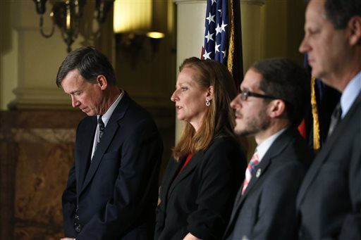 FILE PHOTO: Colorado Gov. John Hickenlooper, left, stands with, right to left, state Senate Minority Leader Rep. Bill Cadman, R-Colorado Springs, Colo. House Speaker Rep. Mark Ferrandino, D-Denver, and state Senate President-elect Morgan Carroll, D-Aurora, during a news conference at which they discussed the bipartisan Safe2Tell Act, a measure to fund and run a successful school danger hotline, at the Capitol, in Denver, Tuesday Jan. 7, 2014. Safe2Tell was established after the Columbine high school massacre to give K-12 students an anonymous hotline to report school safety problems to authorities - including planned school shootings, bullying, and planned suicides. (AP Photo/Brennan Linsley) (Brennan Linsley/Associated Press)