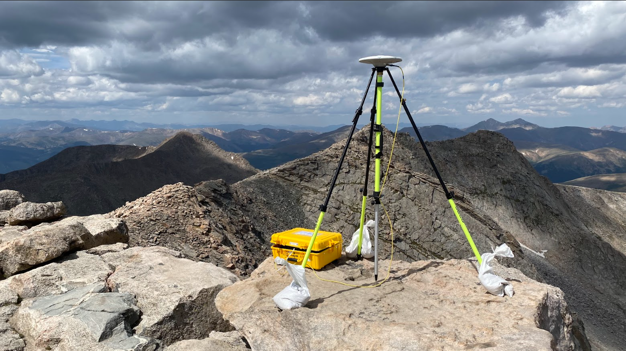 August 23, 2023: A GPS antenna and receiver determine an accurate position and elevation for a geodetic control mark on the top of Mt. Blue Sky, Colorado, elevation 14,266 feet. (Image credit: Brian Shaw/NOAA National Geodetic Survey)