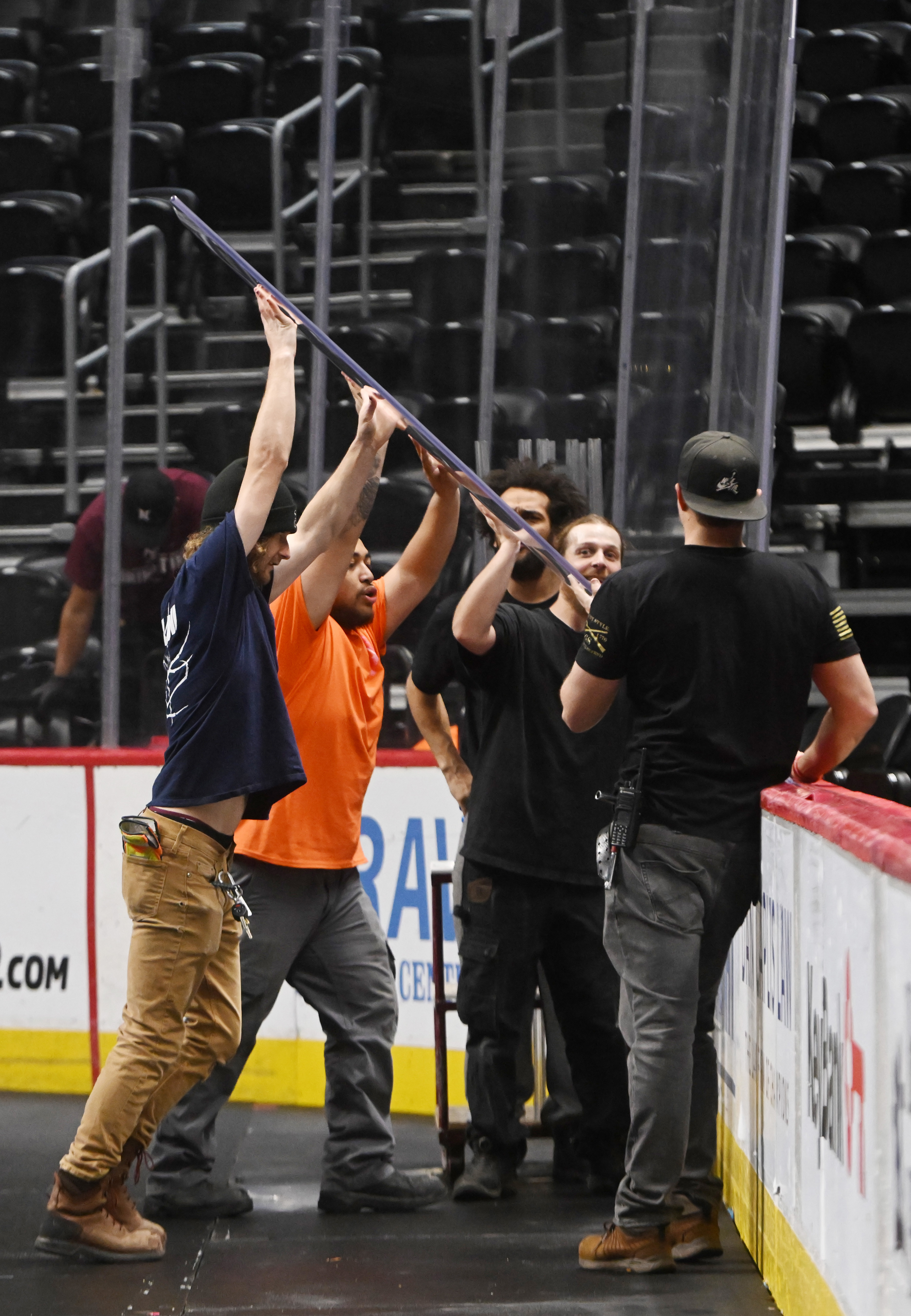 Glass is moved into place by crews during an overnight conversion from Nuggets to Avalanche. Ball Arena was transformed from Nuggets to Avalanche overnight on Thursday, March 21, 2024. (Photo by Jerilee Bennett, The Gazette)