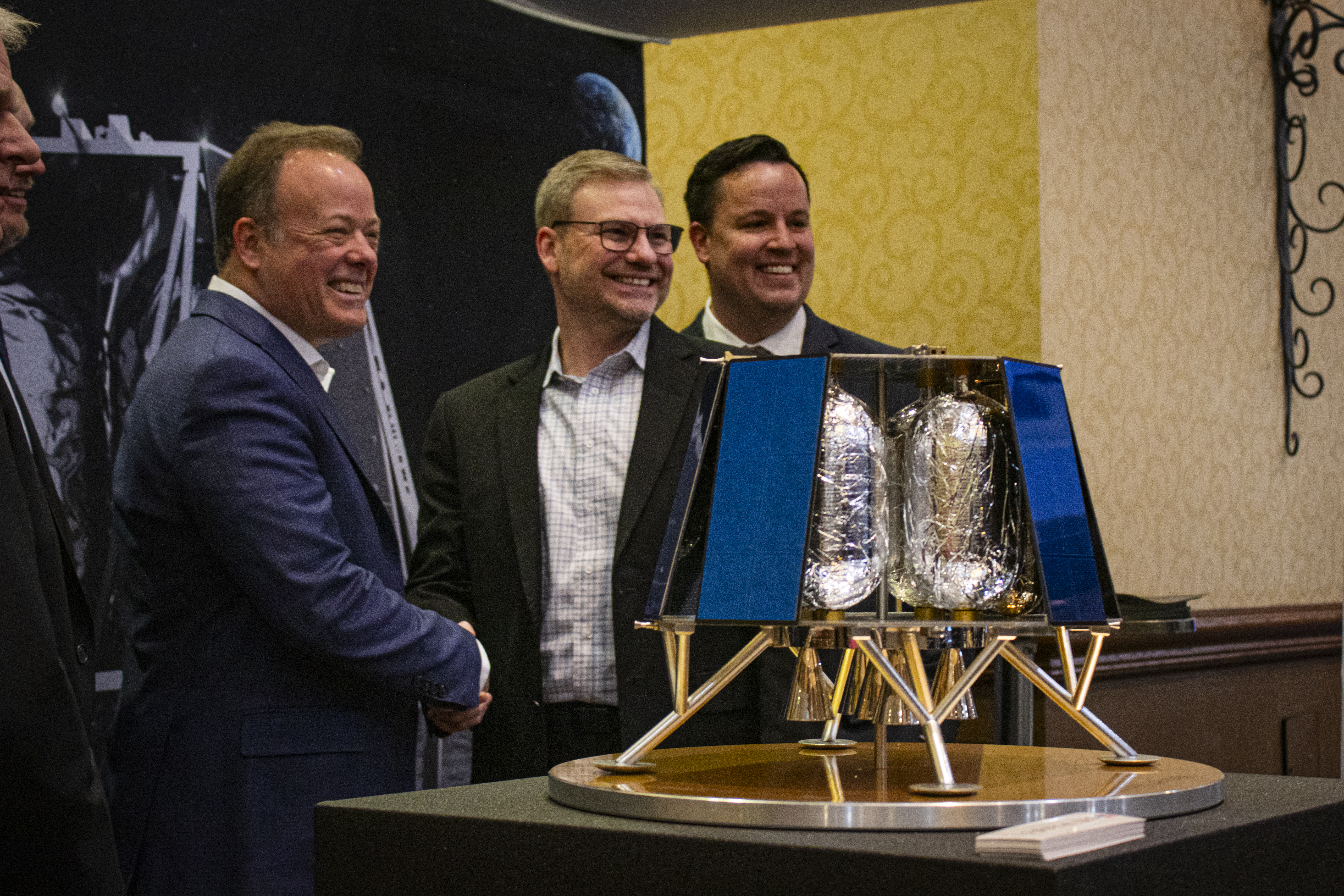 Centennial-based ispace technologies U.S. CEO Ron Garan shakes the hand of Lafayette-based Blue Canyon Technologies General Manager Chris Winslett after announcing the partnership between the two Denver area companies to send a lunar lander to the far side of the moon in 2026 on Tuesday, April 9, 2024 in Colorado Springs. (Bernadette Berdychowski / Denver Gazette)