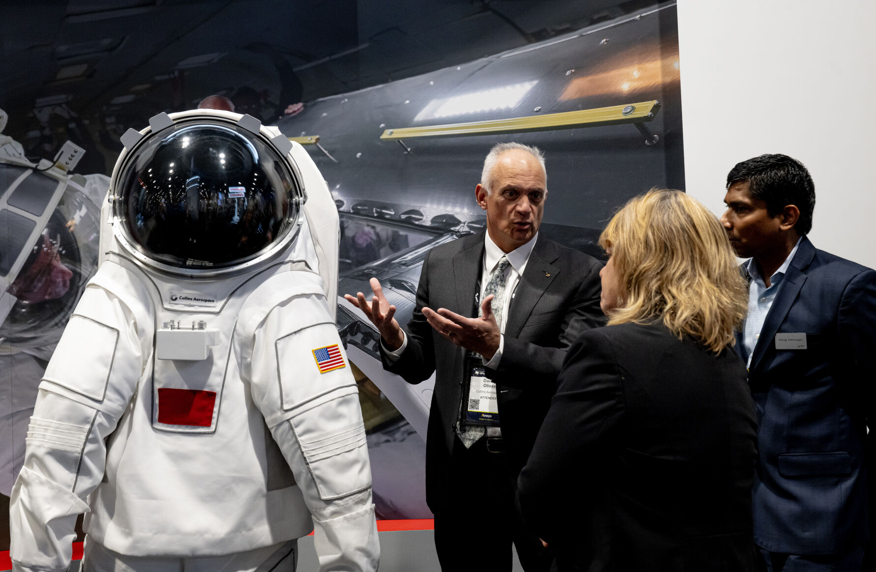 Former NASA astronaut John “Danny” Olives talks with RTX employees about the Collins Aerospace next generation aerospace suit at the 39th Space Foundation Space Symposium at The Broadmoor Hotel, Tuesday, April 9, 2024, in Colorado Springs, Colo. (Parker Seibold, The Gazette) (ParkerSeiboldparker.seibold@gazette.comhttps://secure.gravatar.com/avatar/b5a9c1795b3aa1497ffa7824b99c1d26?d=mm&r=g)