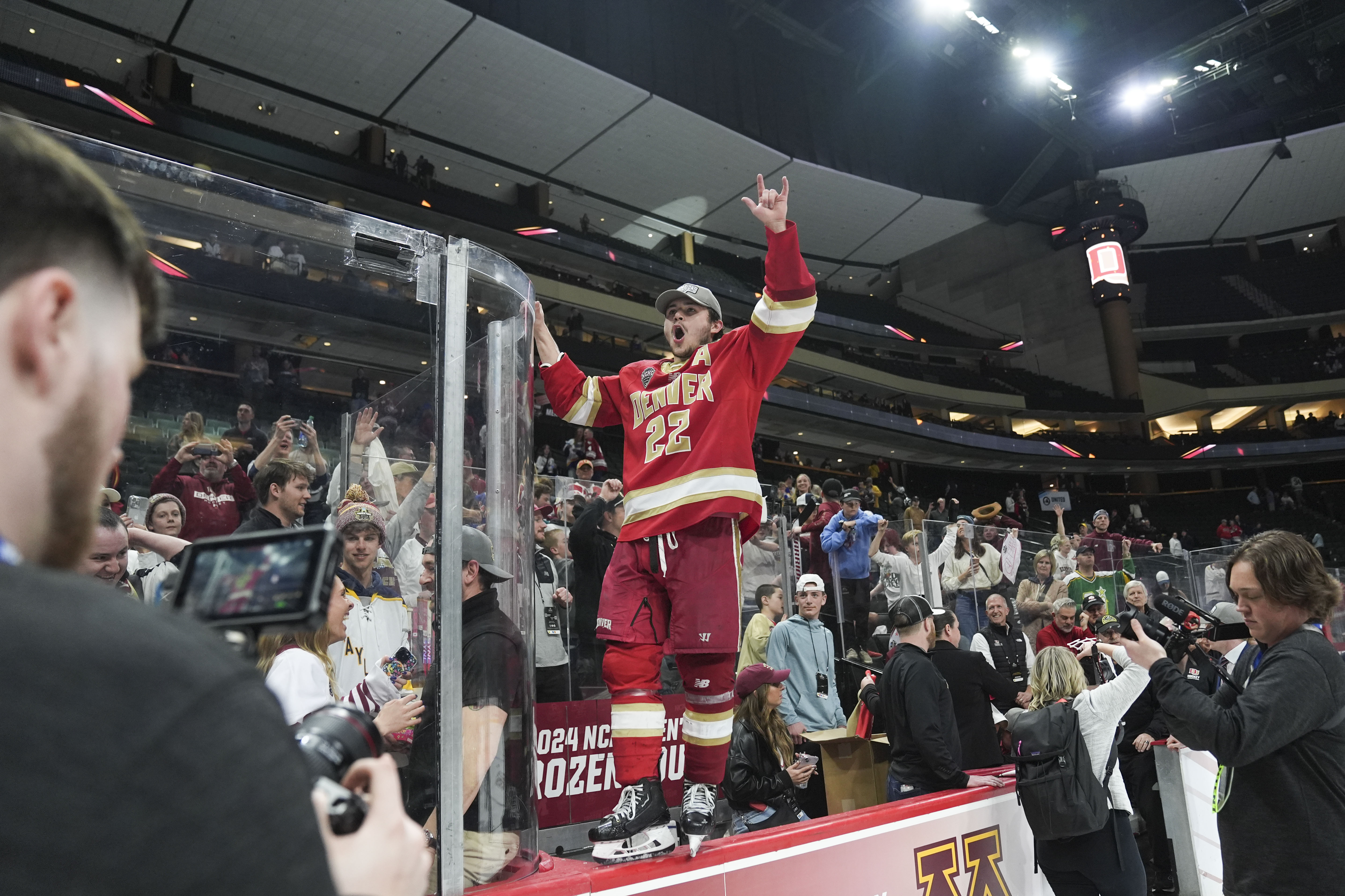 Denver forward Connor Caponi (22) celebrates after defeating Boston College in the championship game of the Frozen Four NCAA college hockey tournament Saturday, April 13, 2024, in St. Paul, Minn. Denver won 2-0 to win the national championship. (AP Photo/Abbie Parr) (Abbie Parr)