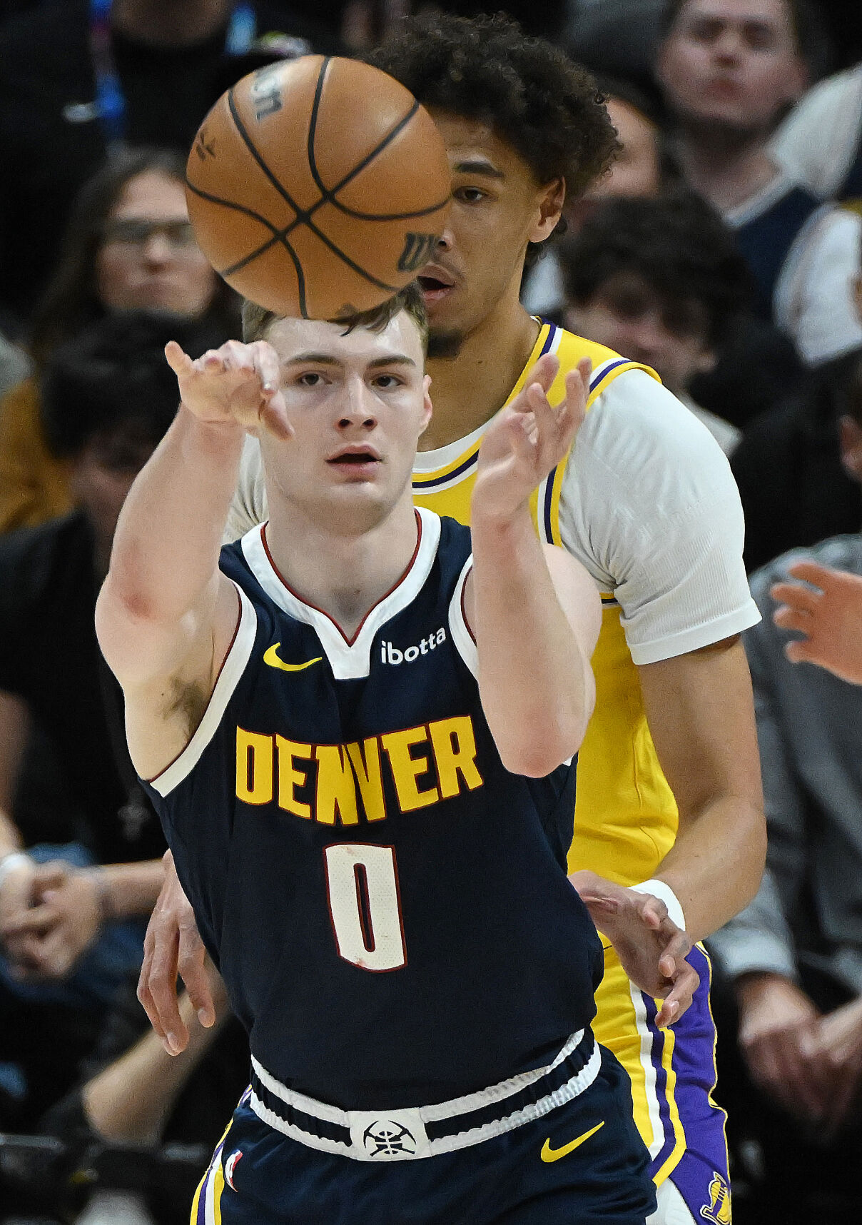 Christian Braun passes the ball during game 5 of the first round of the Western Conference championships at Ball Arena on Monday, April 24, 2024. The Nuggets won the game 108-106. (Photo by Jerilee Bennett, The Gazette)