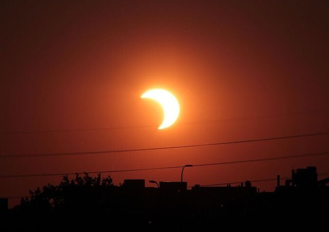A partial solar eclipse occurs when the moon obscures only part of the sun from Earth's view. Image Credit: T. Ruen via NASA