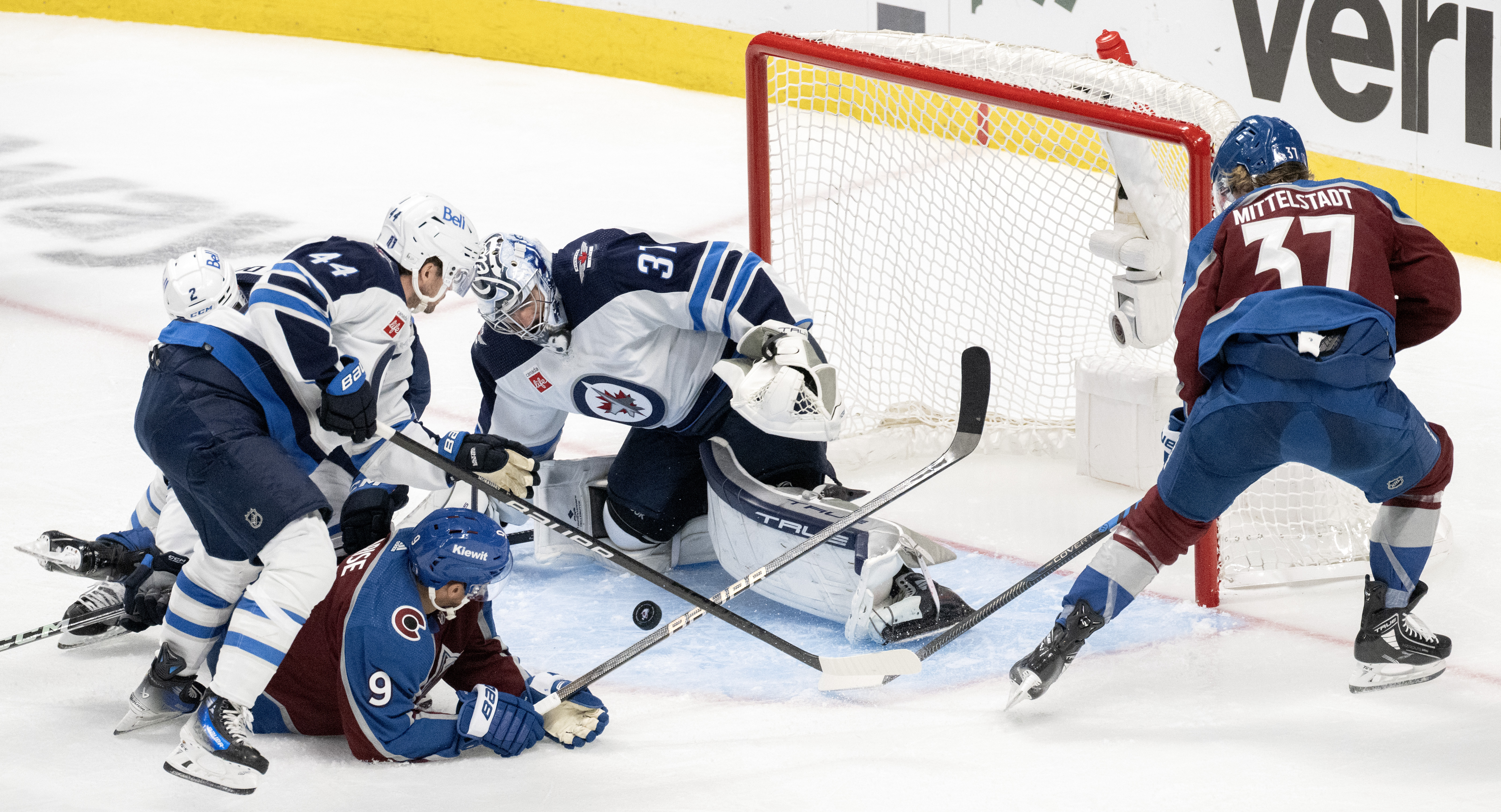 Colorado Avalanche left wing Zach Parise (9) and center Casey Mittelstadt (37) fight for rebound as Winnipeg Jets defenseman Josh Morrissey (44), goaltender Connor Hellebuyck (37) and Winnipeg Jets defenseman Dylan DeMelo (2) defend during the second period in Game 4 of an NHL Stanley Cup first-round playoff series Sunday, April 28, 2024, at Ball Arena in Denver. (The Gazette, Christian Murdock) (Christian Murdock/The Gazette)