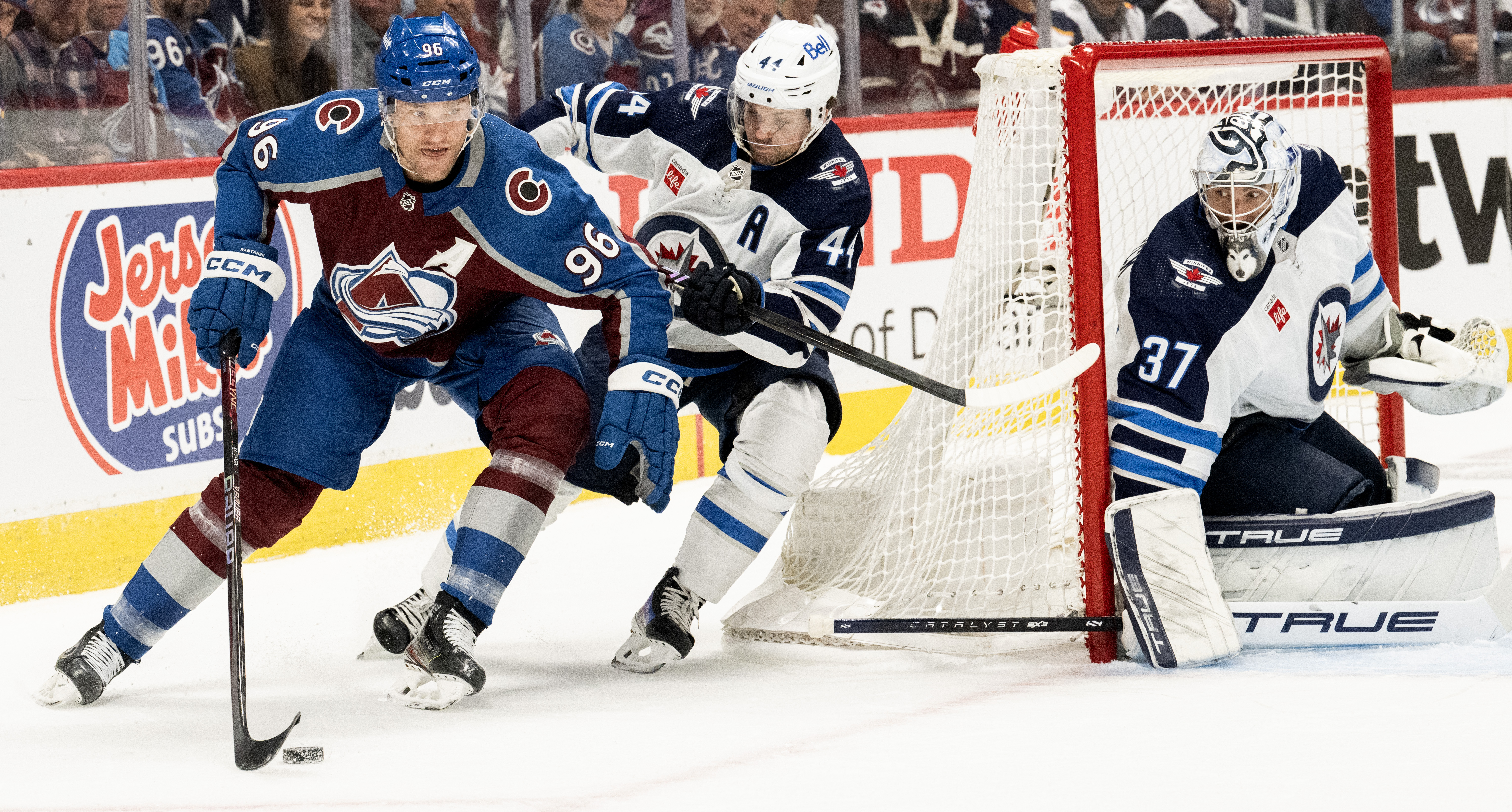 Colorado Avalanche right wing Mikko Rantanen (96) moves the puck behind the Jets goal as Winnipeg Jets defenseman Josh Morrissey (44) defends during the first period in Game 4 of an NHL Stanley Cup first-round playoff series Sunday, April 28, 2024, at Ball Arena in Denver. (The Gazette, Christian Murdock) (Christian Murdock/The Gazette)