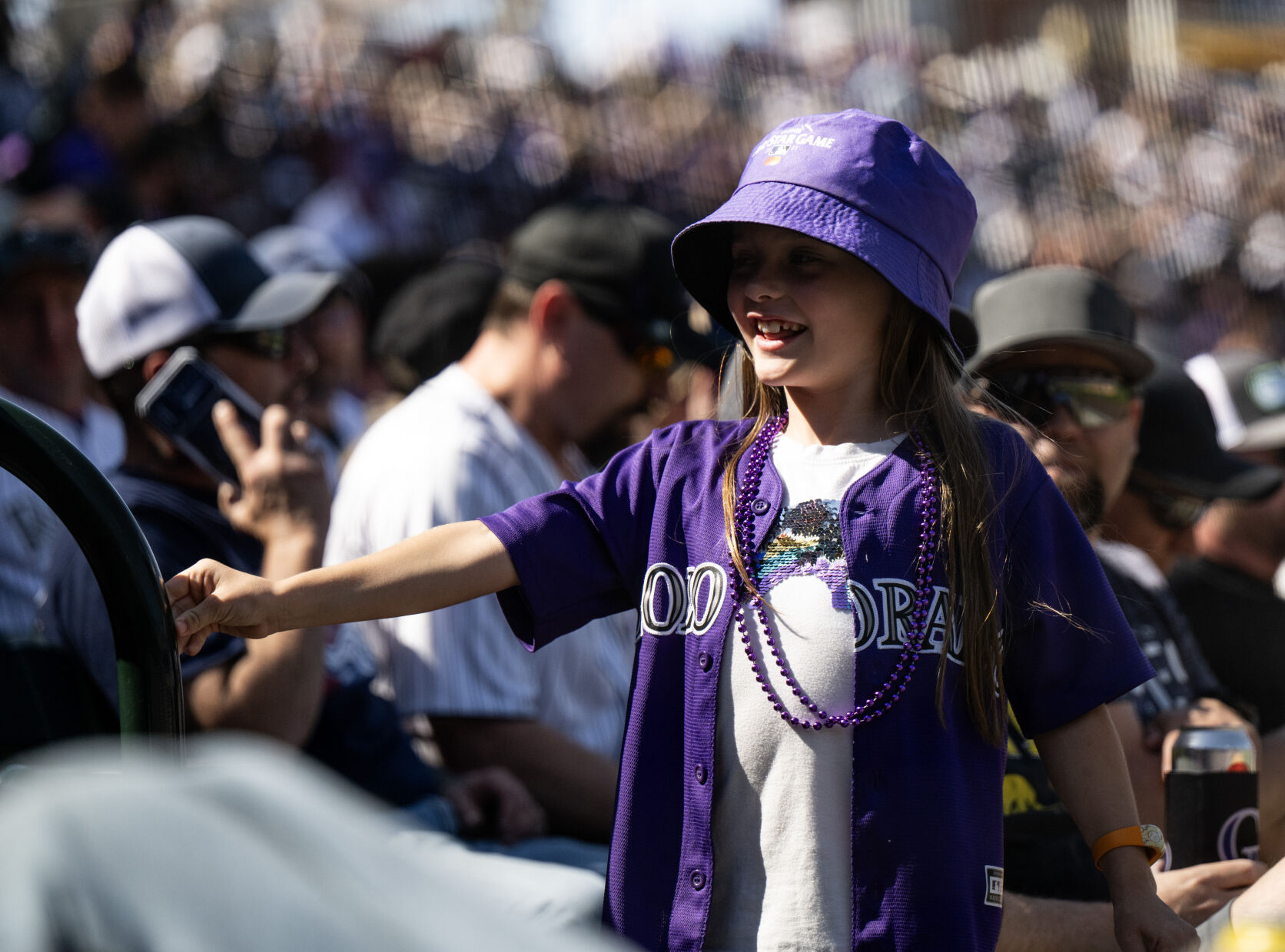 A young Colorado Rockies fan is decked out in purple for opening day at Coors Field, Friday, April 5, 2024, in Denver, Colo. (Parker Seibold, The Gazette) (Parker Seibold)