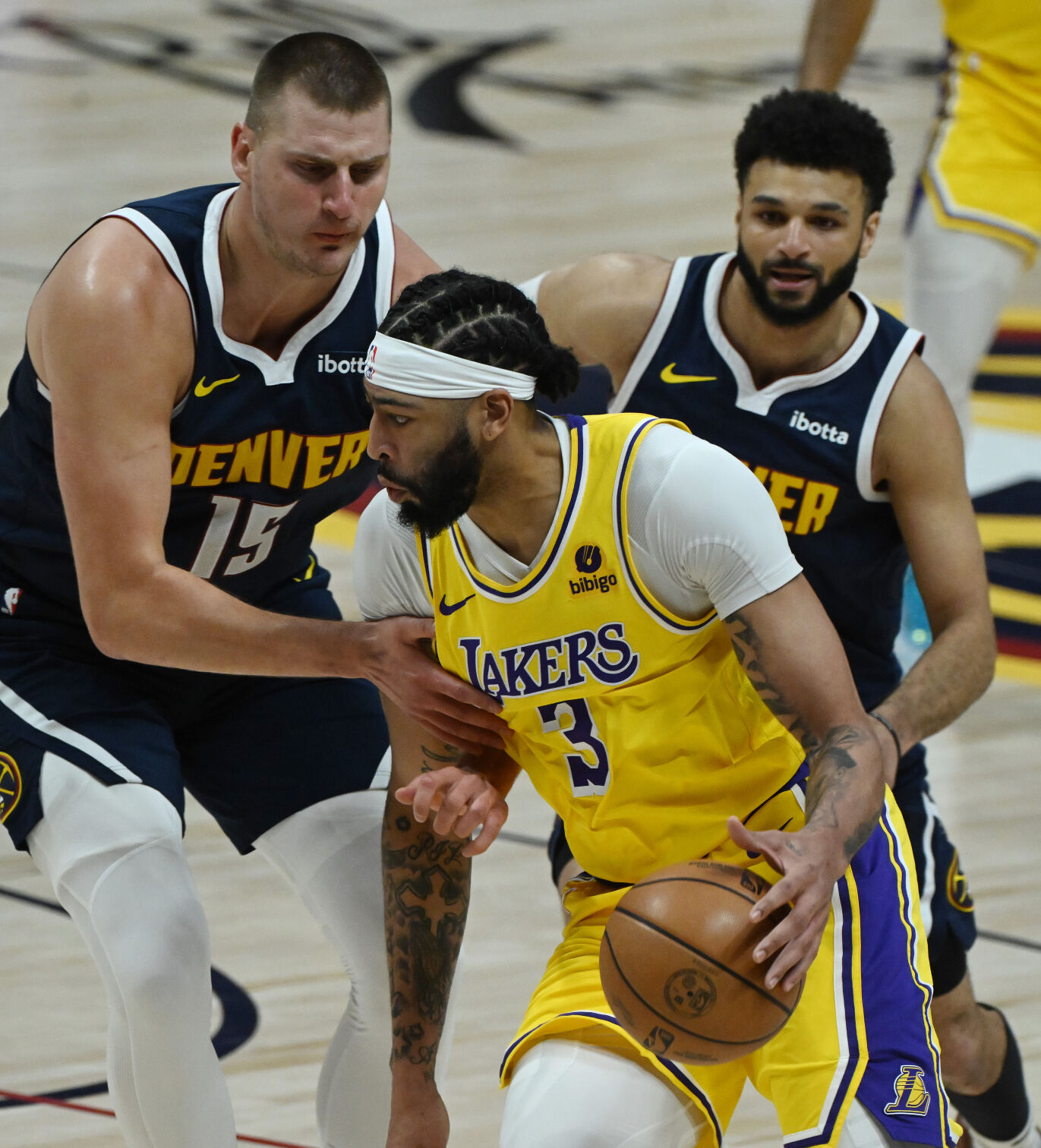 Nikola Jokic and Jamal Murray put pressure on Lakers’ Anthony Davis during the first quarter of game 5 of the first round of the Western Conference championships on Monday, April 29, 2024. (Photo by Jerilee Bennett, The Gazette)
