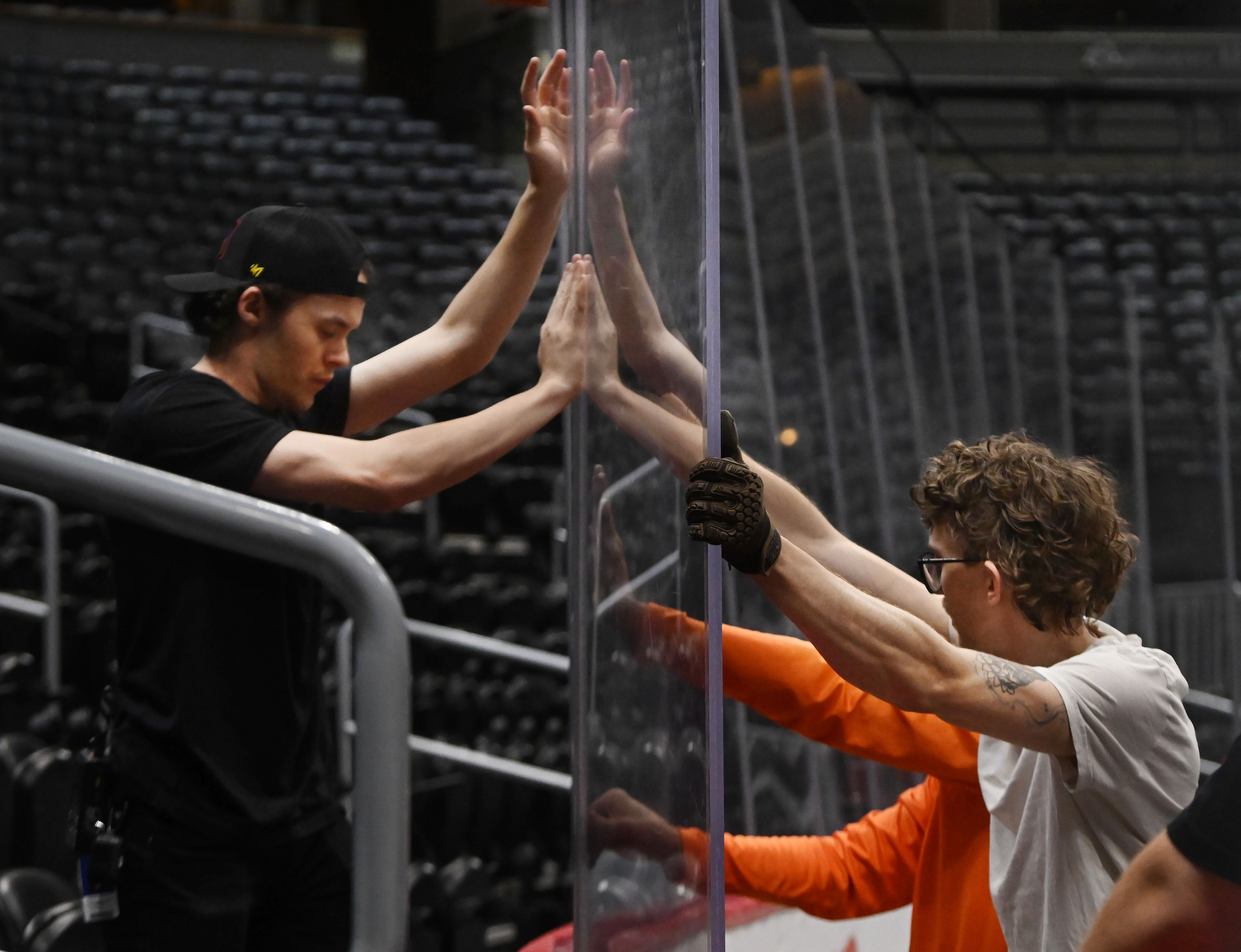 Glass is moved into place by crews during an overnight conversion from Nuggets to Avalanche. Ball Arena was transformed from Nuggets to Avalanche overnight on Thursday, March 21, 2024. (Photo by Jerilee Bennett, The Gazette)