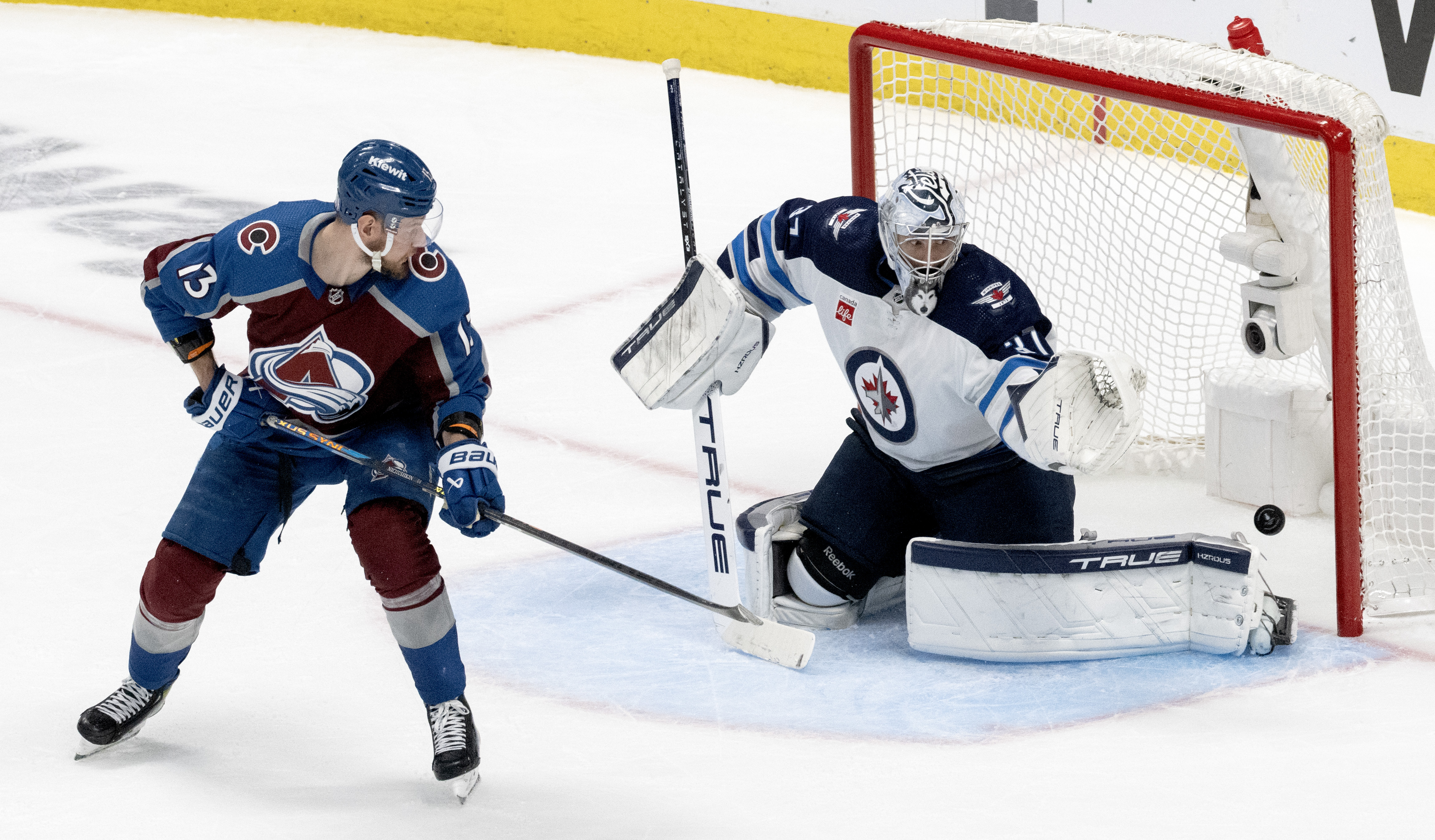 Colorado Avalanche right wing Valeri Nichushkin (13) scores past Winnipeg Jets goaltender Connor Hellebuyck (37) during the second period in Game 4 of an NHL Stanley Cup first-round playoff series Sunday, April 28, 2024, at Ball Arena in Denver. (The Gazette, Christian Murdock) (Christian Murdock/The Gazette)