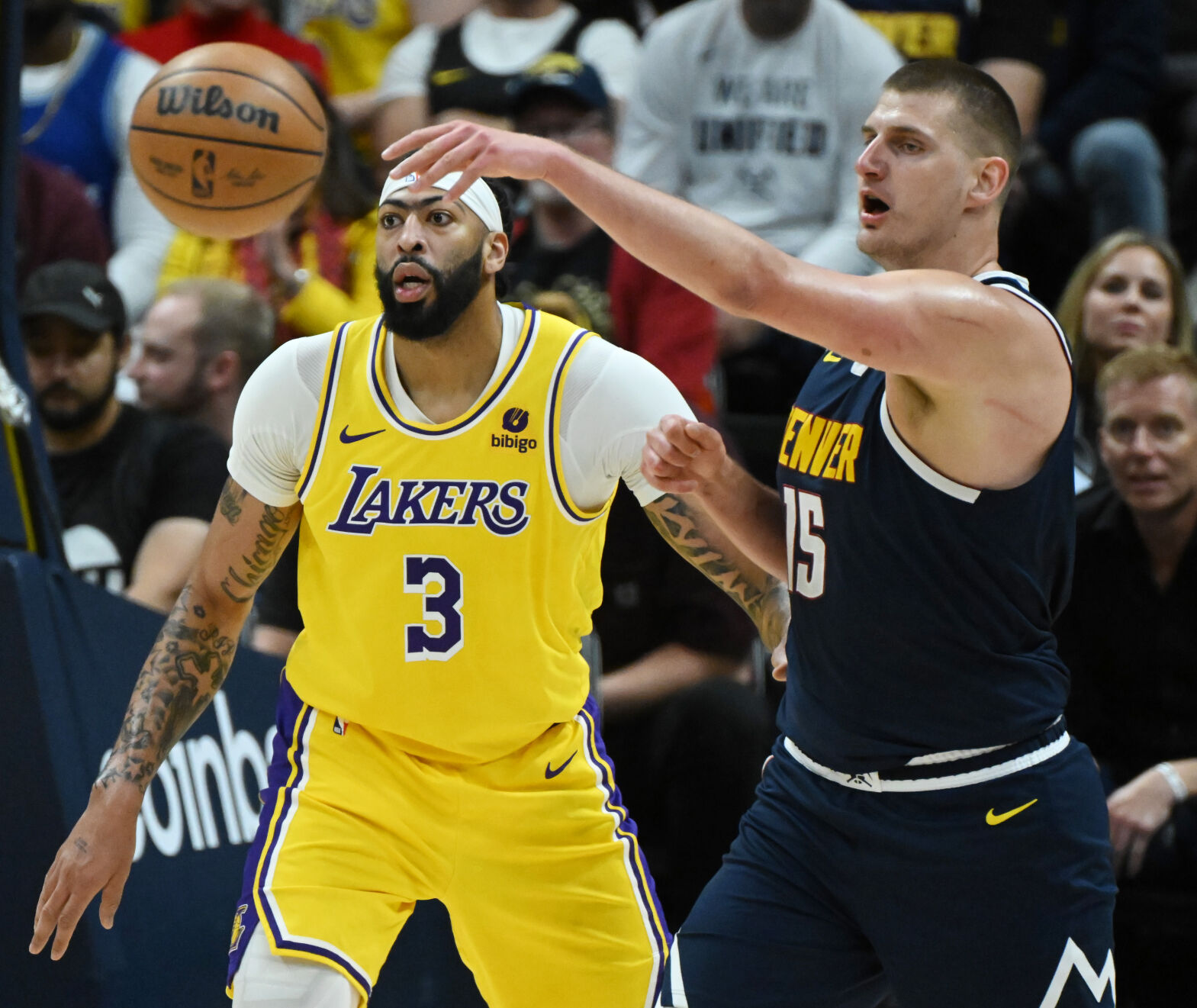 Nikola Jokic passes the ball past Lakers’ Anthony Davis during game 5 of the first round of the Western Conference championships at Ball Arena on Monday, April 24, 2024. The Nuggets won the game 108-106. (Photo by Jerilee Bennett, The Gazette)