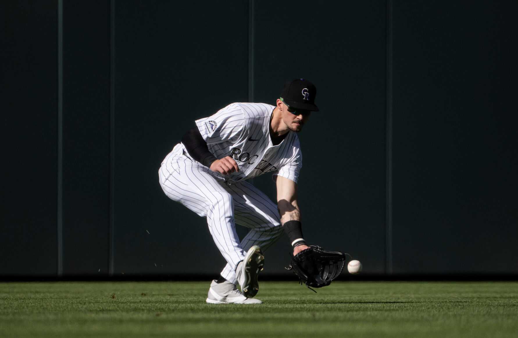 Colorado Rockies outfielder Brenton Doyle (9) gets a ground ball during a game against the Tampa Bay Rays at Coors Field, Friday, April 5, 2024, in Denver, Colo. (Parker Seibold, The Gazette) (Parker Seibold)