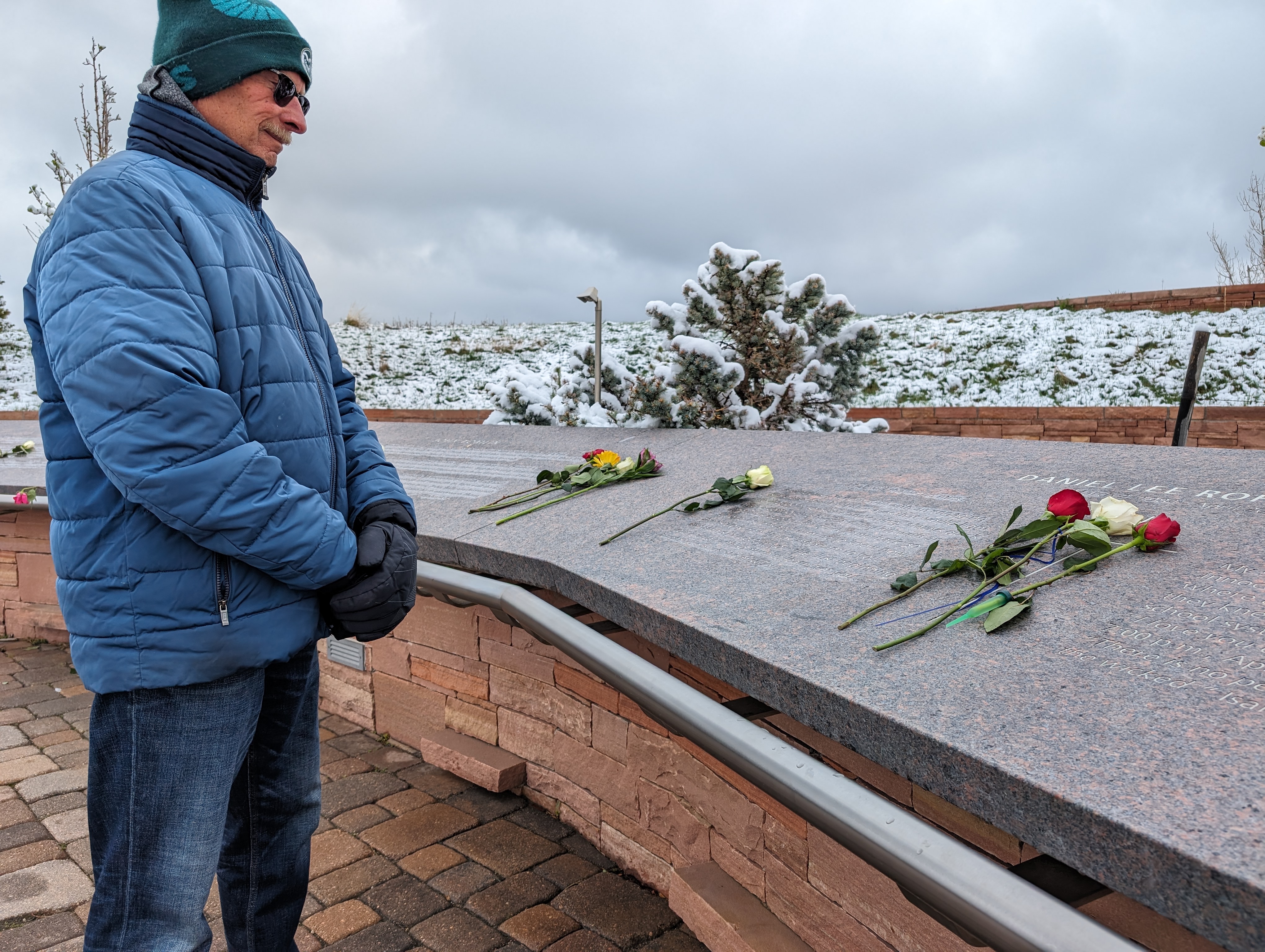 Tim Borus looks over the Columbine memorial on Saturday during the 25th anniversary of the shooting. Borus' son was a student during the incident and survived.