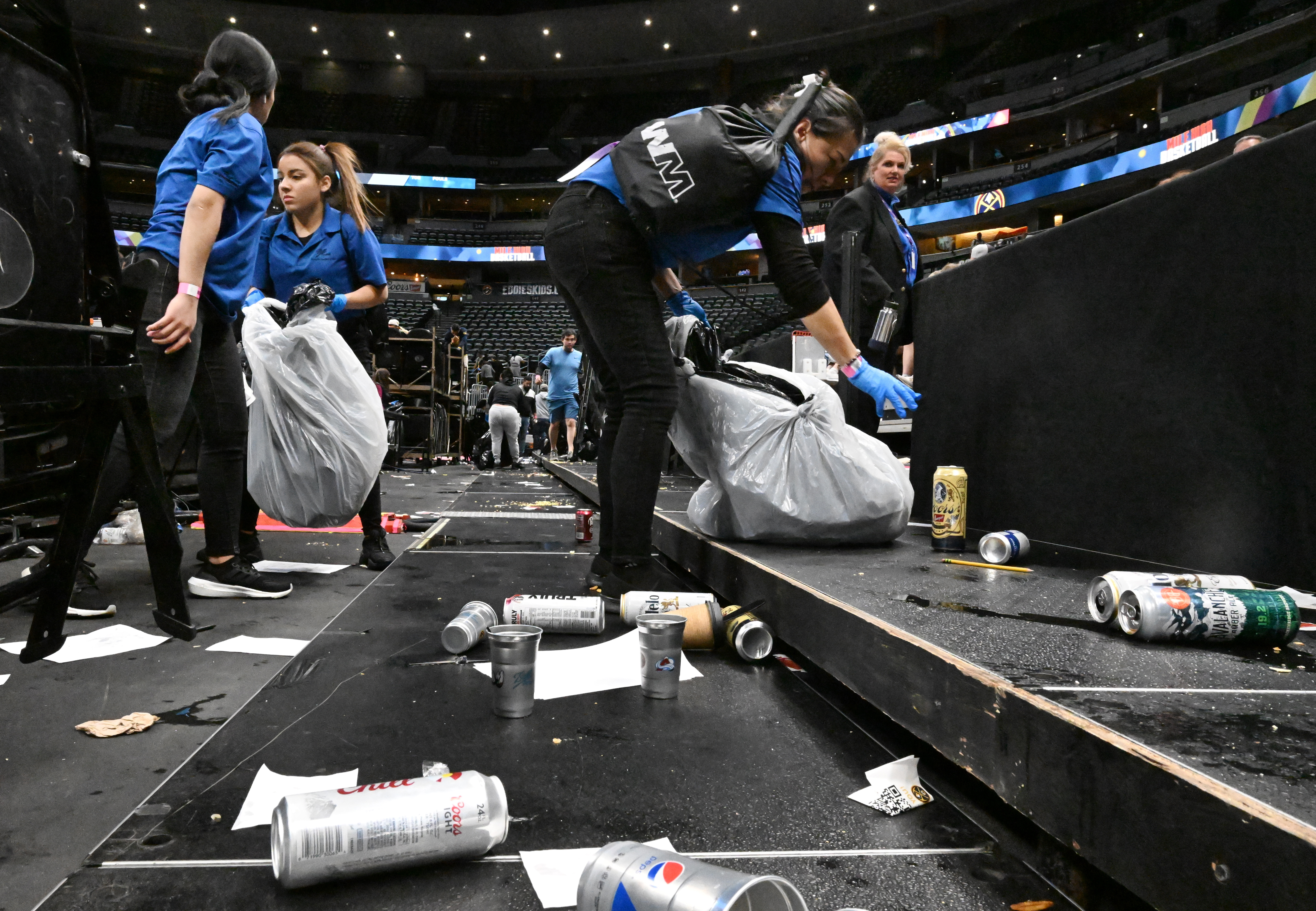 Cleaning crews start the massive job of cleaning up Ball Arena after a Nuggets game. Ball Arena was being transformed from Nuggets to Avalanche overnight on Thursday, March 21, 2024. (Photo by Jerilee Bennett, The Gazette)