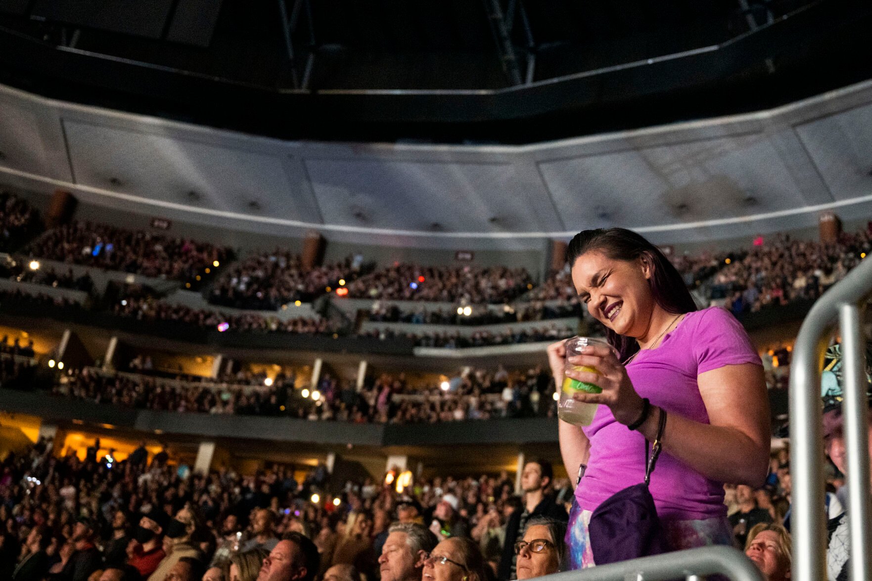 Elton John fan Alexis Kelley sings along while John performs at Ball Arena as part of his Farewell Yellow Brick Road tour on Friday, Nov. 4, 2022, in Denver, Colo. This is Kelley’s forth Elton John concert for just this ongoing tour.(Timothy Hurst/The Gazette) (TIMOTHY HURST/DENVER GAZETTE)