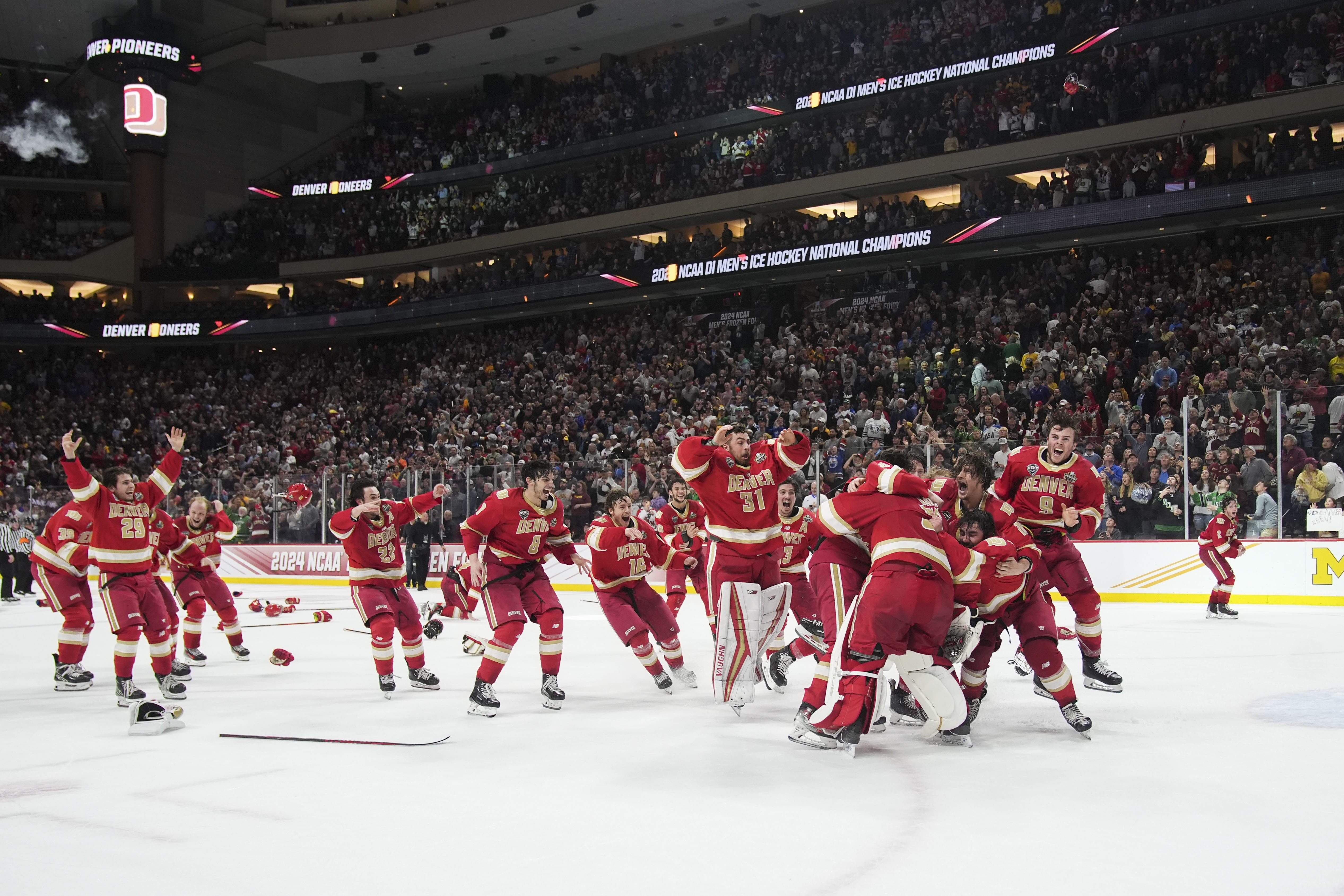Denver celebrates after winning the championship game against Boston College in the Frozen Four NCAA college hockey tournament Saturday, April 13, 2024, in St. Paul, Minn. Denver won 2-0 to win the national championship. (AP Photo/Abbie Parr) (Abbie Parr)