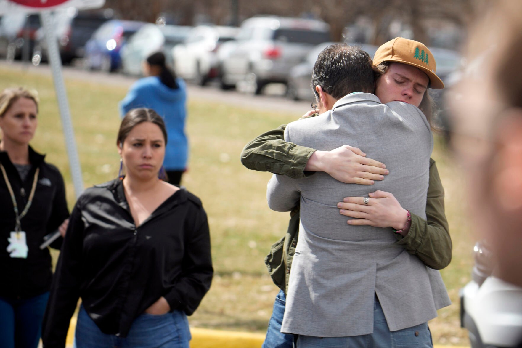 FILE PHOTO: A student, right, hugs a parent as they are reunited following a shooting at East High School, Wednesday, March 22, 2023, in Denver. (David Zalubowski/Associated Press)