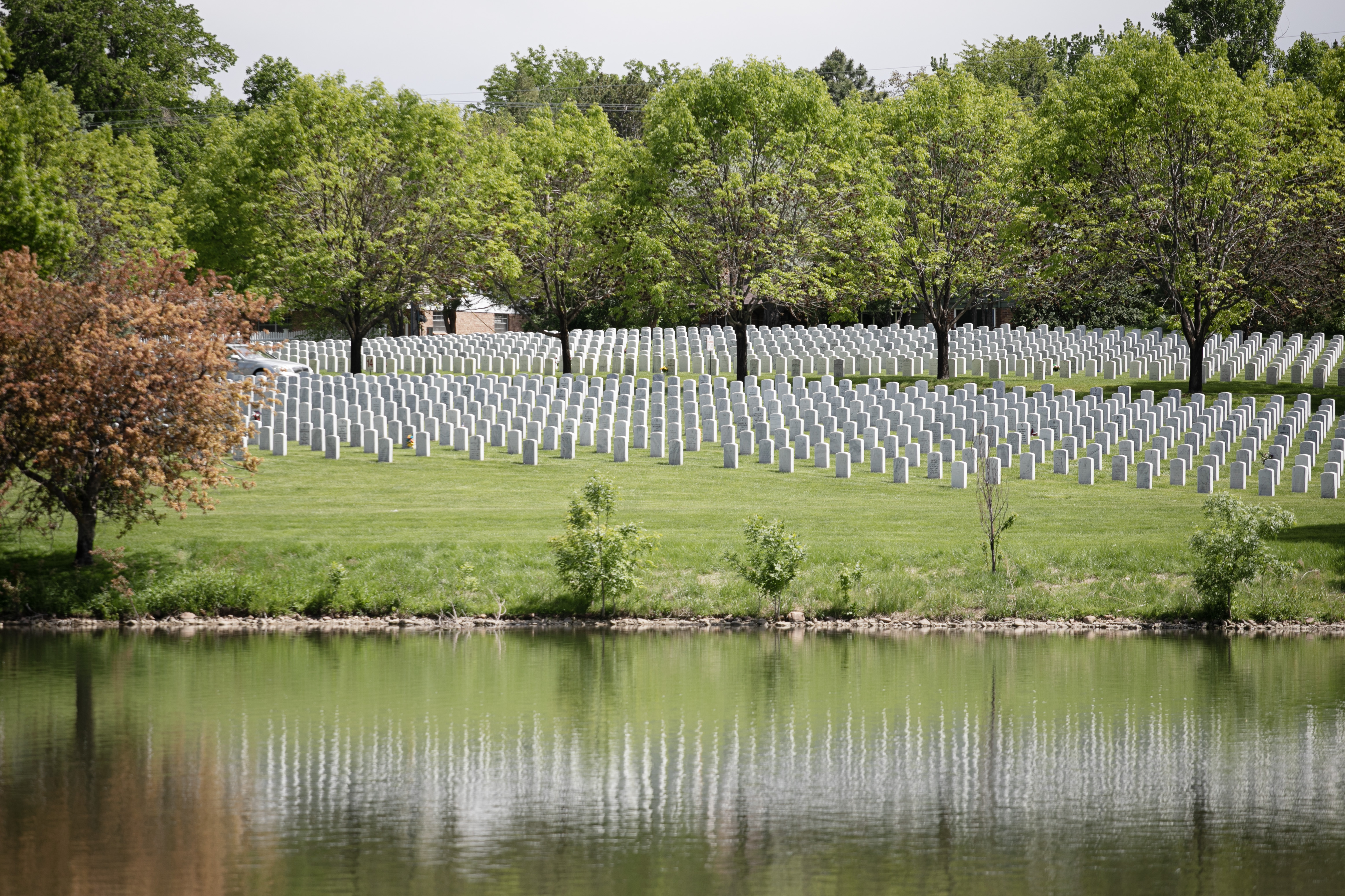 Tombstones reflect in a pond at Fort Logan National Cemetery on Friday, May 24, 2024. (TomHellauerMultimedia Producertom.hellauer@denvergazette.comhttps://denvergazette.com/content/tncms/avatars/f/9e/622/f9e6228a-3b6b-11ed-bf10-fbb71fa8e421.f54b911252c540f1d61709edc4727a39.png)