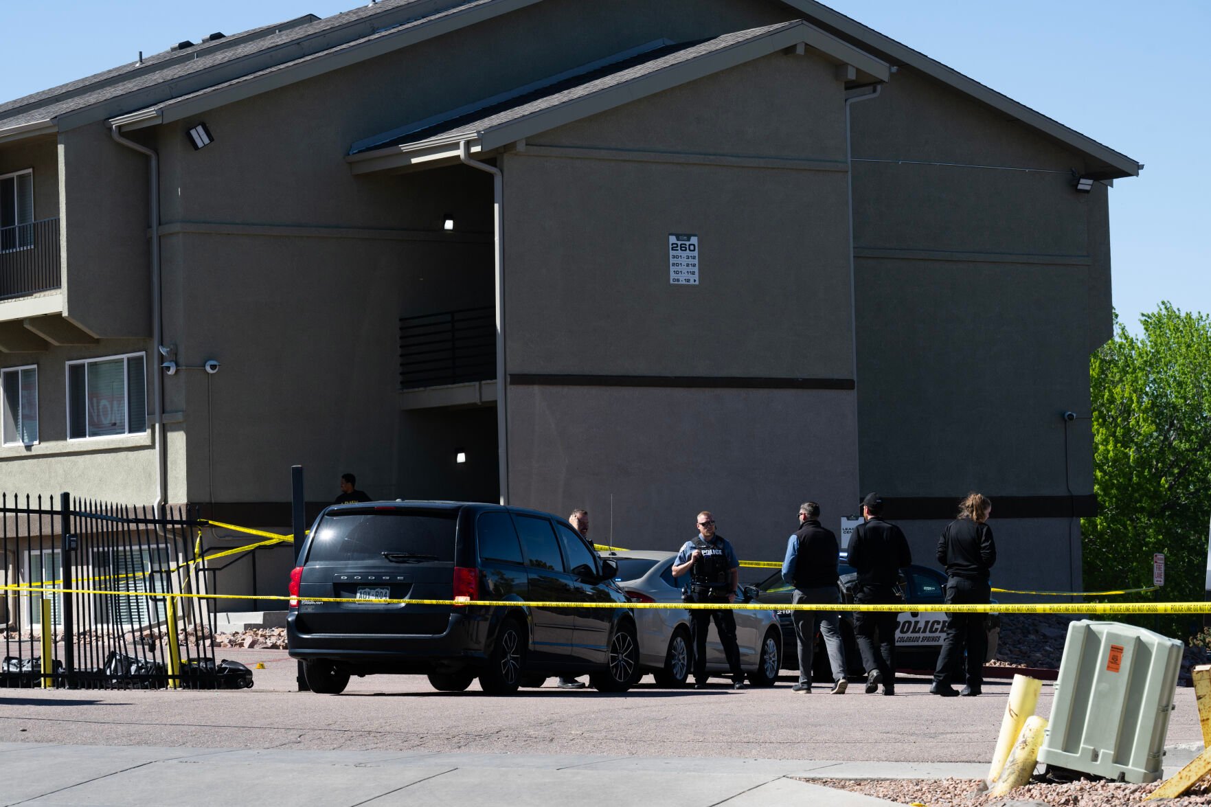 Colorado Springs police on Friday investigate the scene of a shooting that left two dead and one injured at the Stone Canyon Apartments the night before. (Christian Murdock, The Gazette)