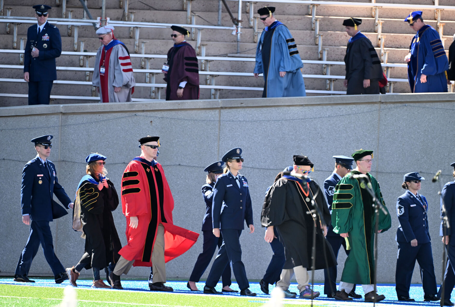 Professors and educators at the Air Force Academy take the field before the commencement begins. The class of 2024 of the United States Air Force Academy held their graduation at Falcon Stadium on Thursday, May 30, 2024. (Photo by Jerilee Bennett, The Gazette)