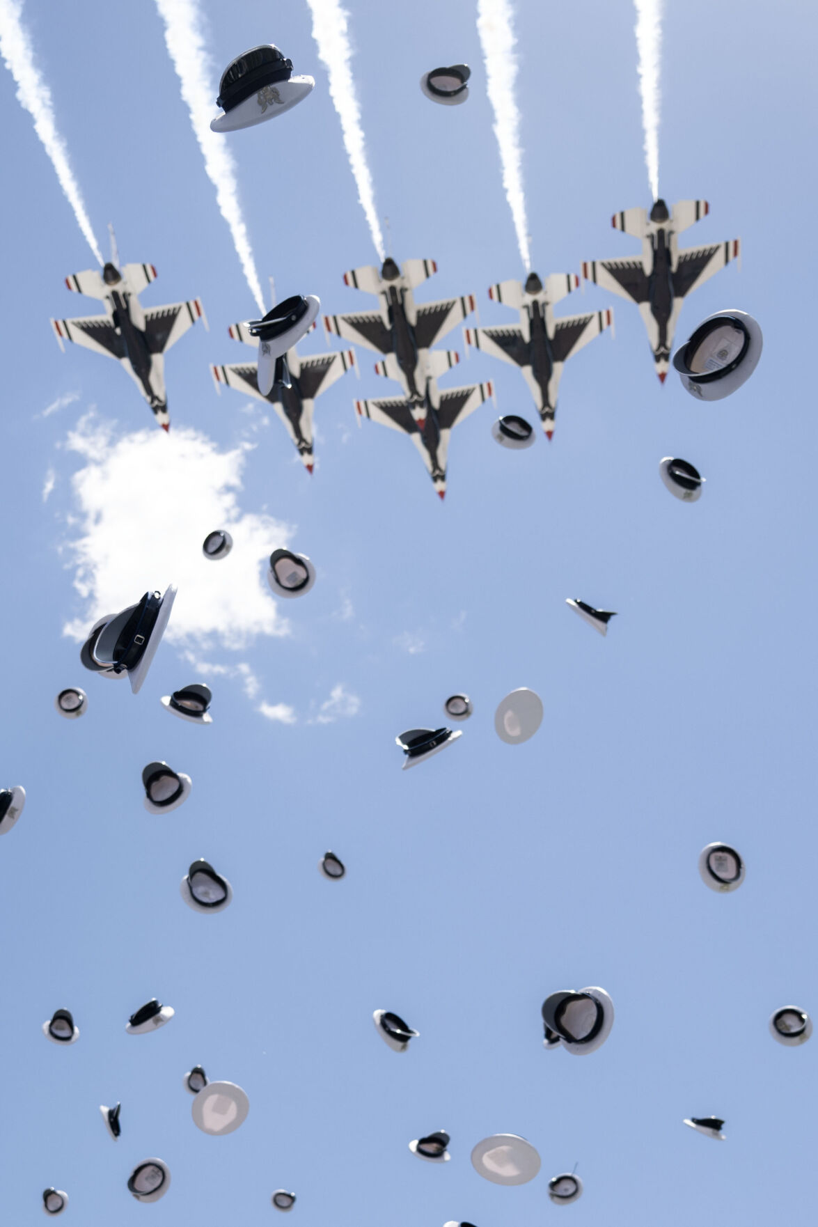 Air Force Graduates celebrate as the Thunderbirds fly over Falcon Stadium at the conclusion of the Air Force Academy Graduation on Thursday, May 30, 2024. (Stephen Swofford, The Gazette) (Stephen Swofford The Gazette)