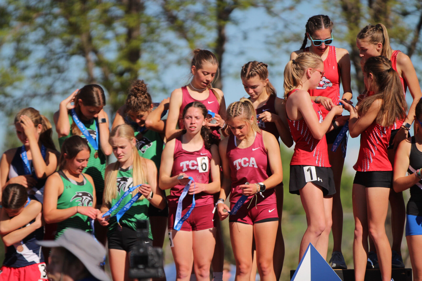 The Classical Academy girls 4x800 relay (center) check out their medals won at the Colorado State Track and Field Championships at Jeffco Stadium on Thursday, May 16, 2024. (Marcus Hill, The Gazette) (marcus.hill@gazette.comhttps://secure.gravatar.com/avatar/0c9378738333374e5590886e4d4a0493?d=mm&r=g)