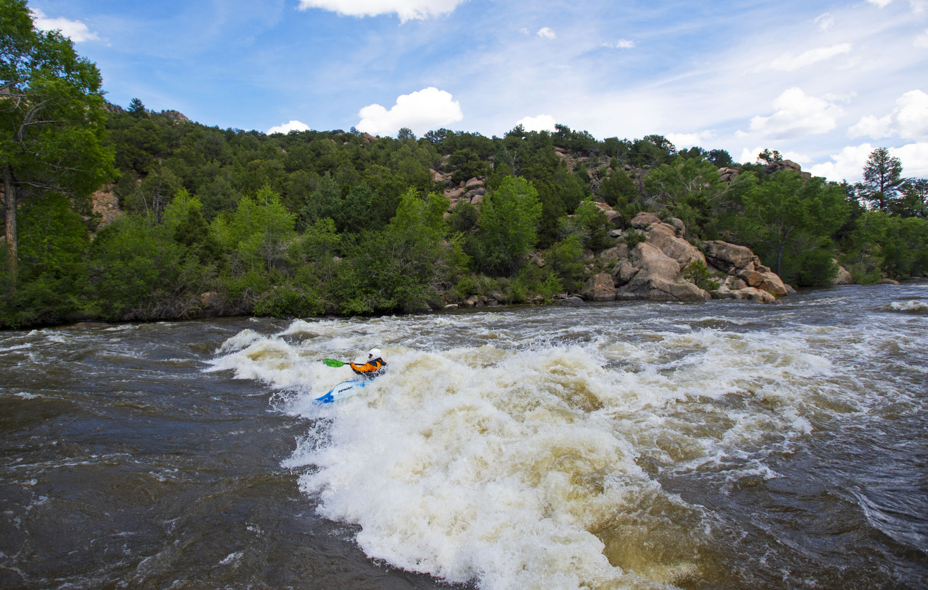 Garrett Finn holds his kayak in a rapid at Buena Vista Whitewater Park on Thursday, June 13. The Arkansas River continues to swell with high levels of rainfall and snow continuing to melt from the mountains. (Parker Seibold/The Gazette)