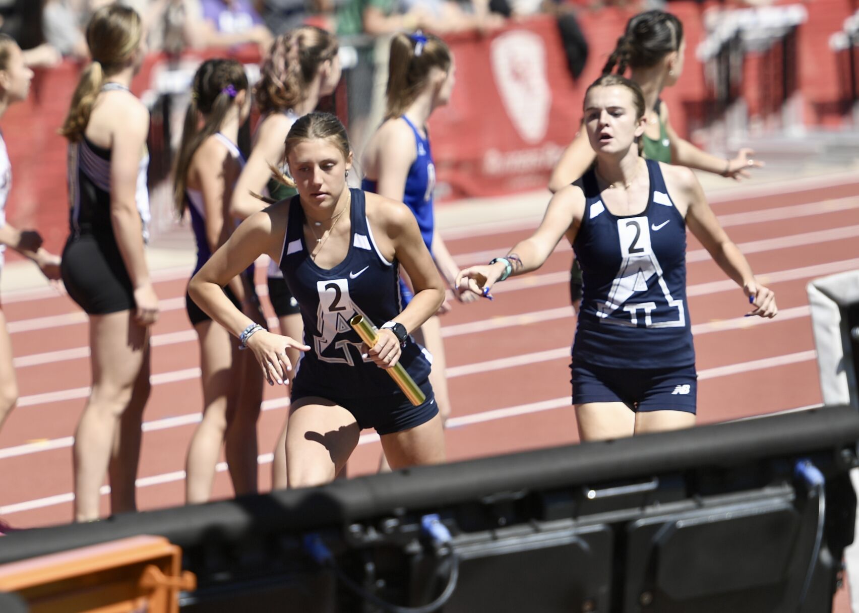 Air Academy's Lauren Myers takes the baton from Bethany Michalak at the CHSAA state track and field championships on Thursday, May 16, 2024. (CarsonFieldcarson.field@gazette.comhttps://secure.gravatar.com/avatar/c524ef3d384945349bed78d70eb2d2cd?d=mm&r=g)