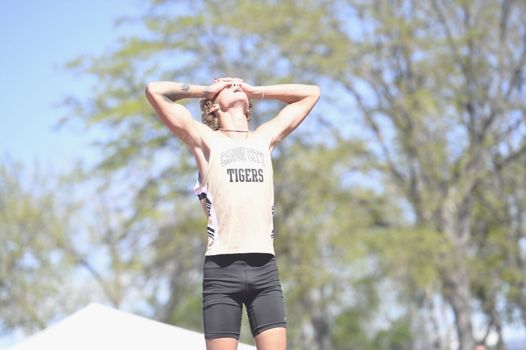 Canon City's Wyatt Turner reacts with disappointment after missing on his final attempt at 6-foot-7 in the 4A boys' high jump on Thursday. (BRENT BRIGGEMAN, THE GAZETTE)
