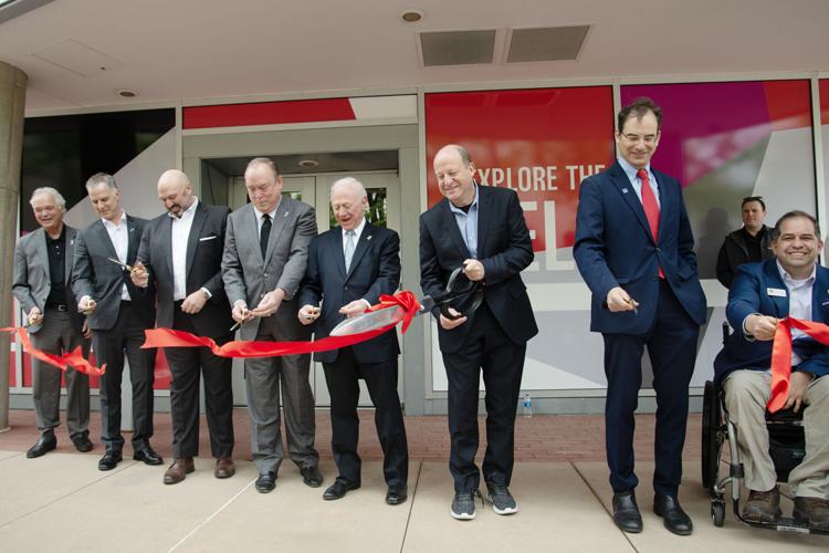 Local officials, experts and Counterterrorism Education Learning Lab (CELL) staff cut a ribbon