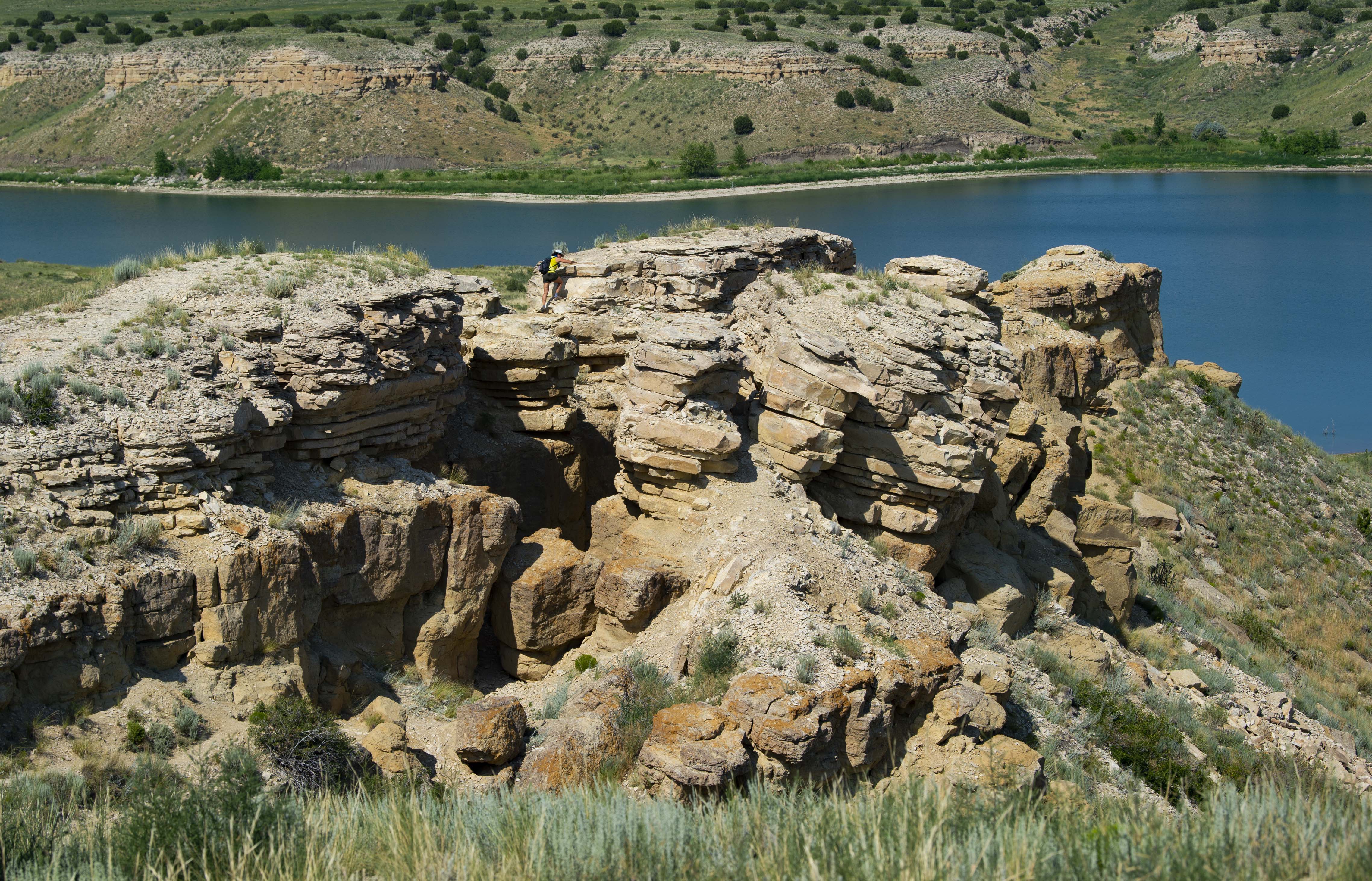 A hiker makes her way to the end of the trail to Arkansas Point for a view of Lake Pueblo below Thursday, July 22, 2021, at Lake Pueblo State Park. See Happy Trails in Monday's Gazette for more information on the hike. (The Gazette, Christian Murdock) (Christian Murdock/The Gazette)
