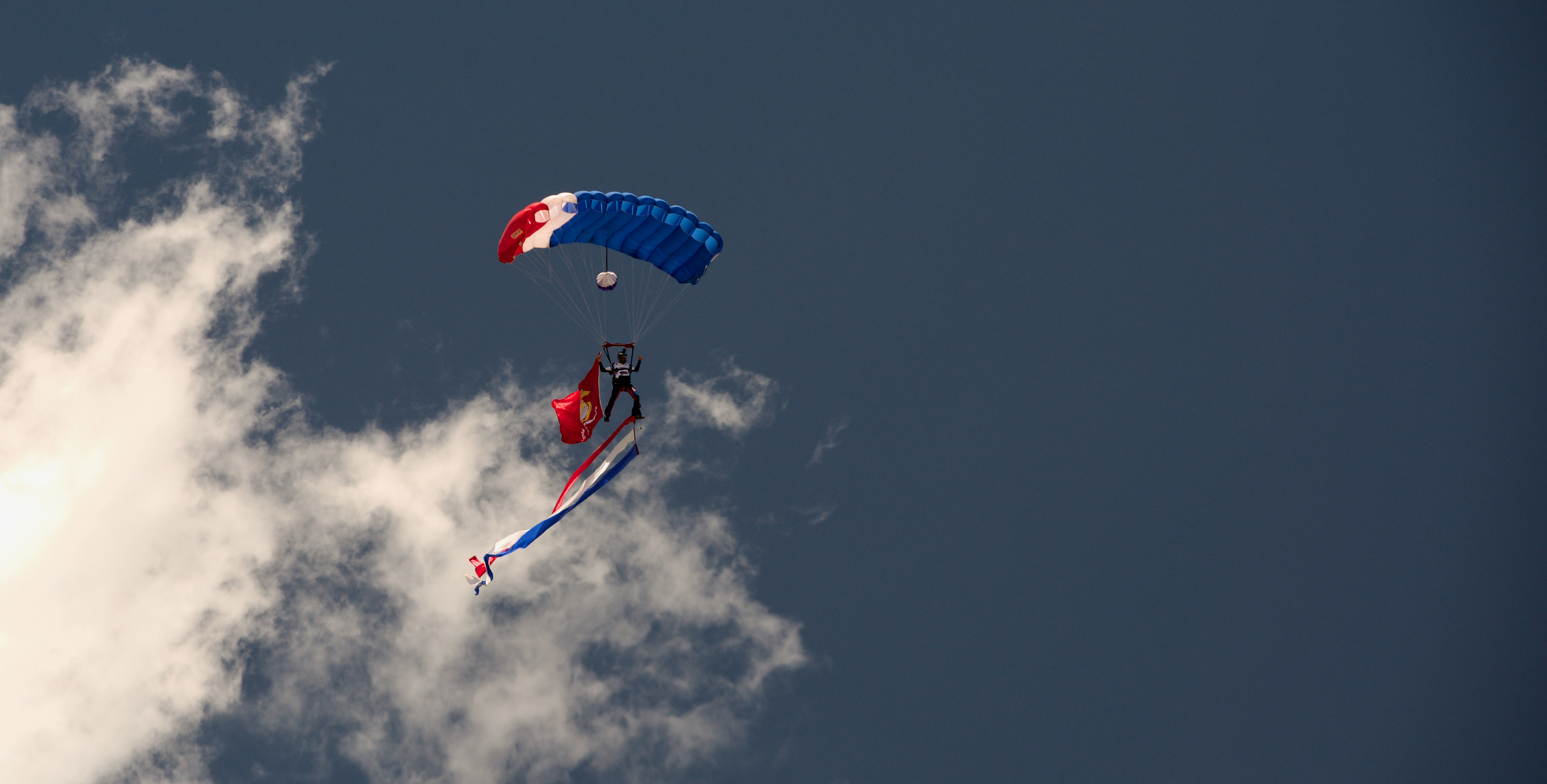 As part of Memorial Day celebrations in Boulder on May 27, 2024, a parachutist representing the United States Marine Corps leapt from an airplane carrying the services flag. All six branches of the United States military, Air Force, Army, Navy, Marine Corps, Coast Guard and Space Force, were represented. (Alex Edwards/The Denver Gazette) (AlexanderEdwardsBusiness Reporteralex.edwards@gazette.comhttps://secure.gravatar.com/avatar/dbaa50cc8a9183e280c297e3afa72ace?d=mm&r=g)