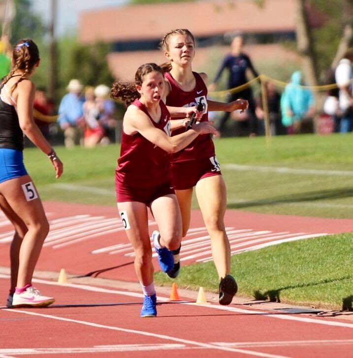 The Classical Academy girls 4x800 relay complete a hand off for the final leg of the race at the Colorado State Track and Field Championships at Jeffco Stadium on Thursday, May 16, 2024. (Marcus Hill, The Gazette) (marcus.hill@gazette.comhttps://secure.gravatar.com/avatar/0c9378738333374e5590886e4d4a0493?d=mm&r=g)