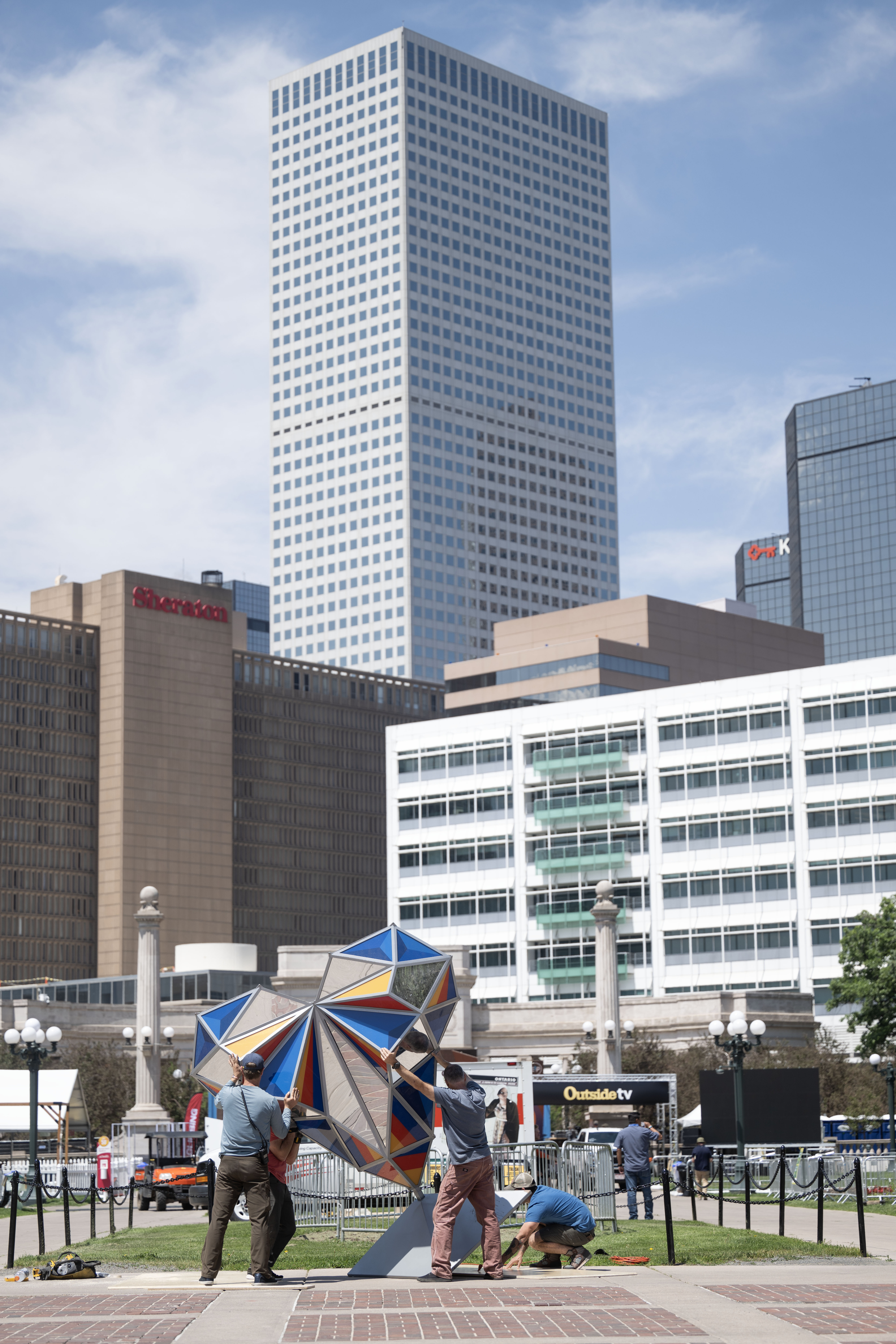 People set up an art display at the inaugural Outside Festival at Civic Center Park on Friday, May 31, 2024. The festival runs Saturday and Sunday. (Stephen Swofford, Denver Gazette) (Stephen Swofford/Denver Gazette)
