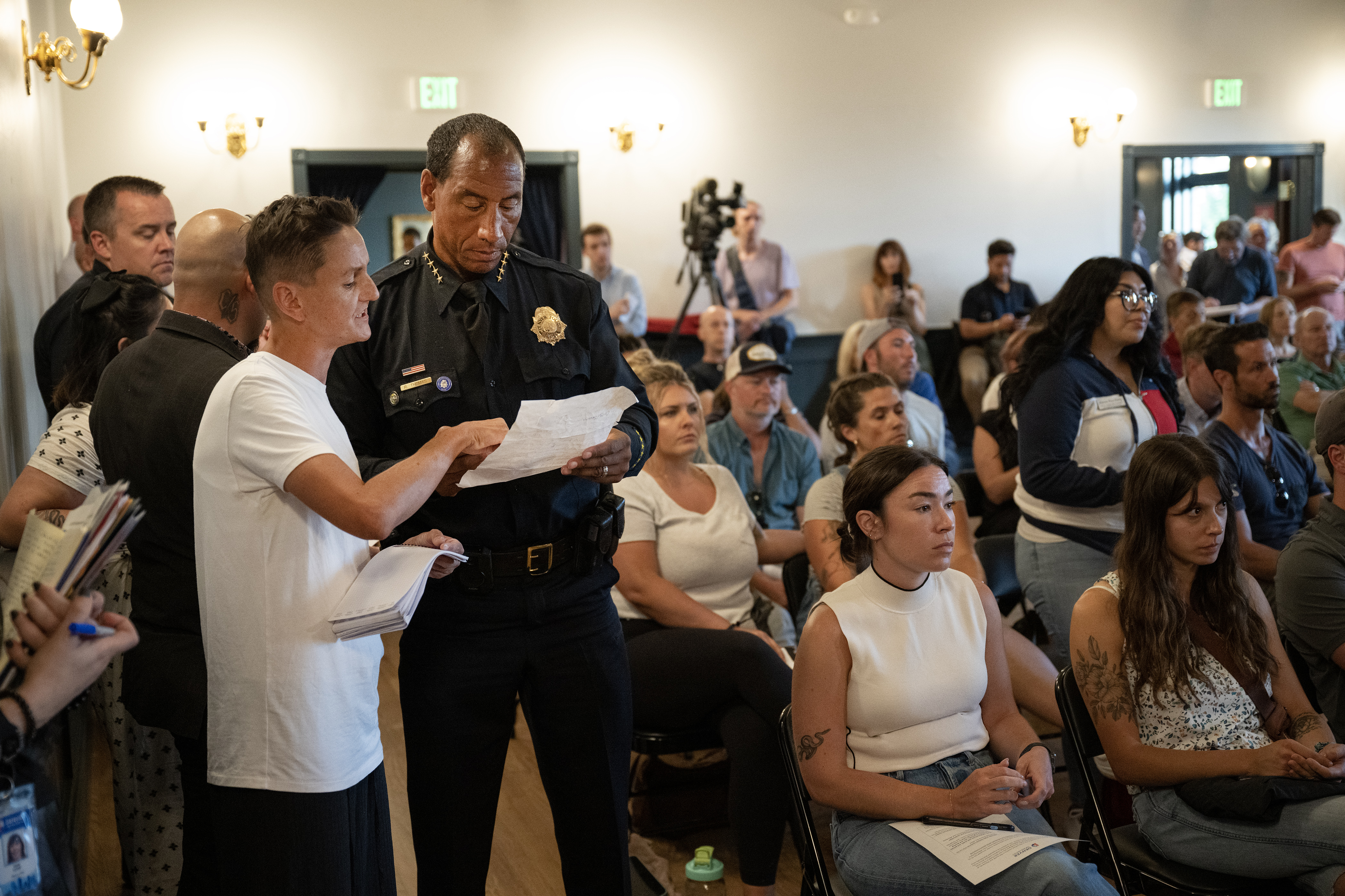 Chey Kosack speaks with Denver chief of police Ron Thomas after asking a question during an open Q&A portion of the first community engagement meetings with Mayor Mike Johnston and City Council members discussing the administration’s Homelessness State of Emergency, this one in the Curtis Park neighborhood, at The Savoy Denver on Tuesday, July 25, 2023, in Denver, Colo. Kosack mentioned an unsolved assault that she was the victim of in her question. (Timothy Hurst/Denver Gazette) (TimHursttim.hurst@gazette.comhttps://secure.gravatar.com/avatar/aca82bd62b4ee425c598527cd6faa1b1?d=mm&r=g)