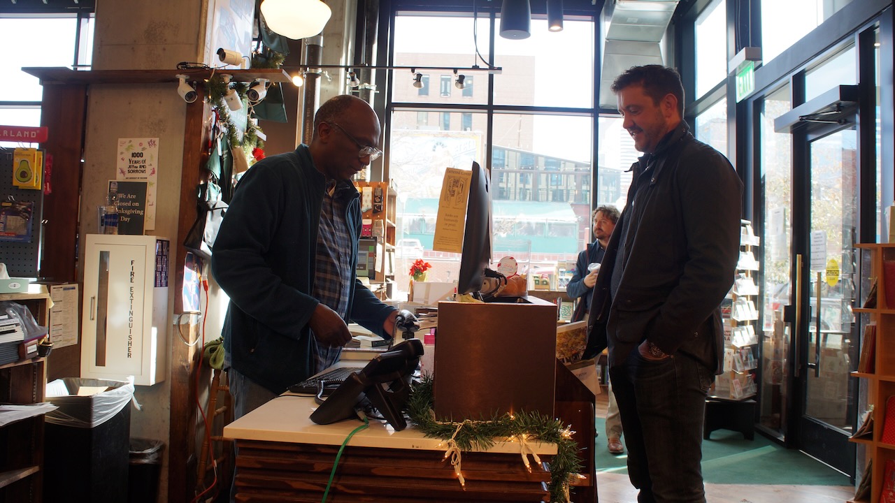 FILE PHOTO: A cashier rings up items purchased by Brett Story. The Tattered Cover is a popular spot for last minute gifts, especially on Christmas Eve. (AlexanderEdwardsBusiness Reporteralex.edwards@gazette.comhttps://secure.gravatar.com/avatar/dbaa50cc8a9183e280c297e3afa72ace?d=mm&r=g)