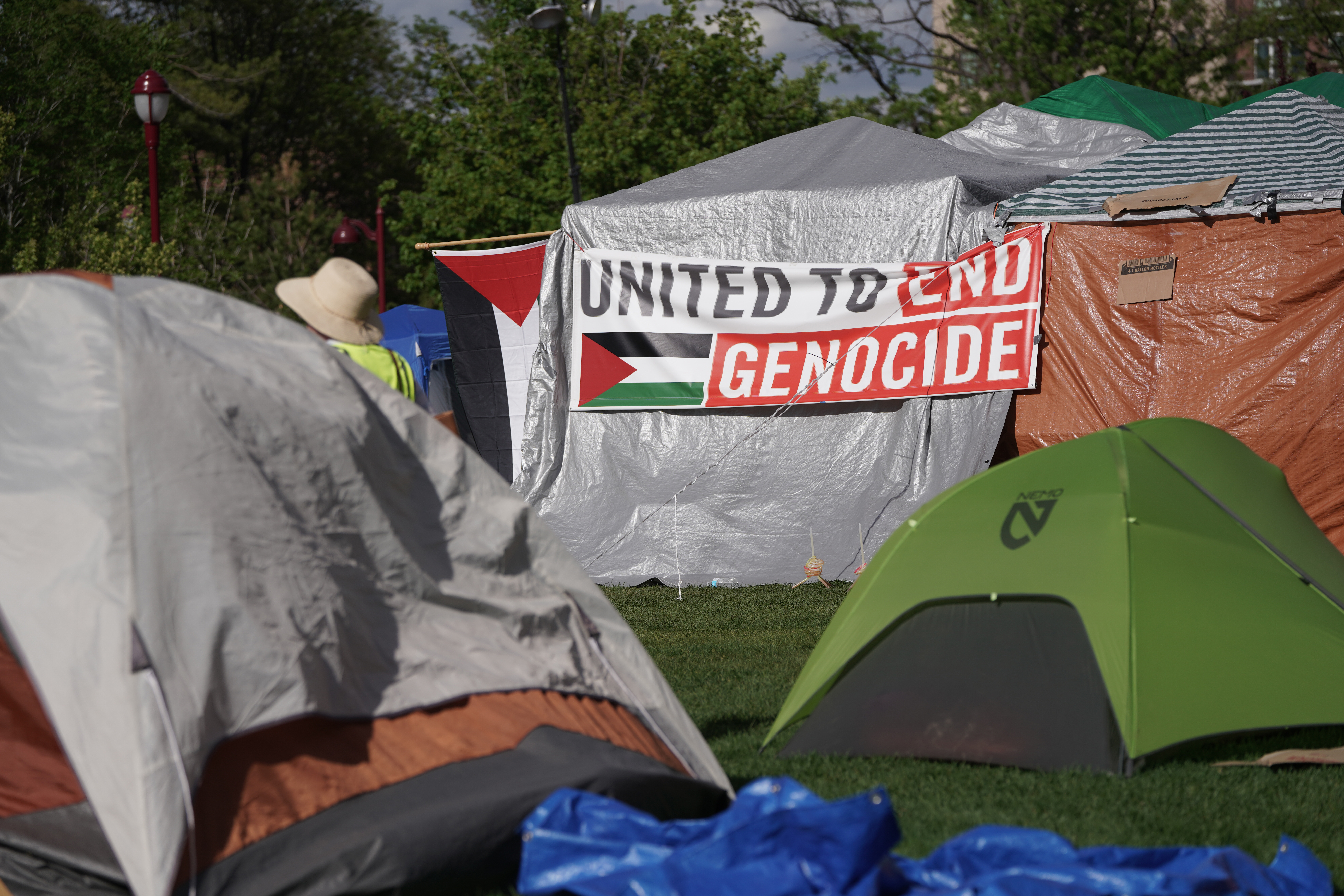 Signs hanging on tents of the pro-Palestinian encampment at the University of Denver in Denver, Friday, May 17, 2024. (Rebecca Slezak/Special to The Denver Gazette) (Rebecca Slezak/Special to The Denver Gazette)