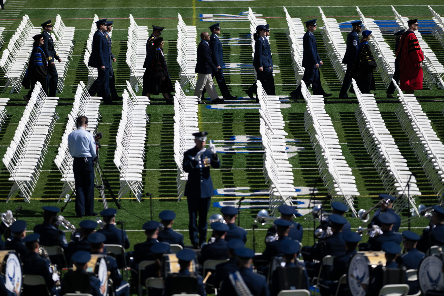 A procession of faculty kicks off the United States Air Force Academy graduation at Falcon Stadium on Thursday, May 30, 2024, in Colorado Springs, Colo. (Parker Seibold, The Gazette) (Parker Seibold)