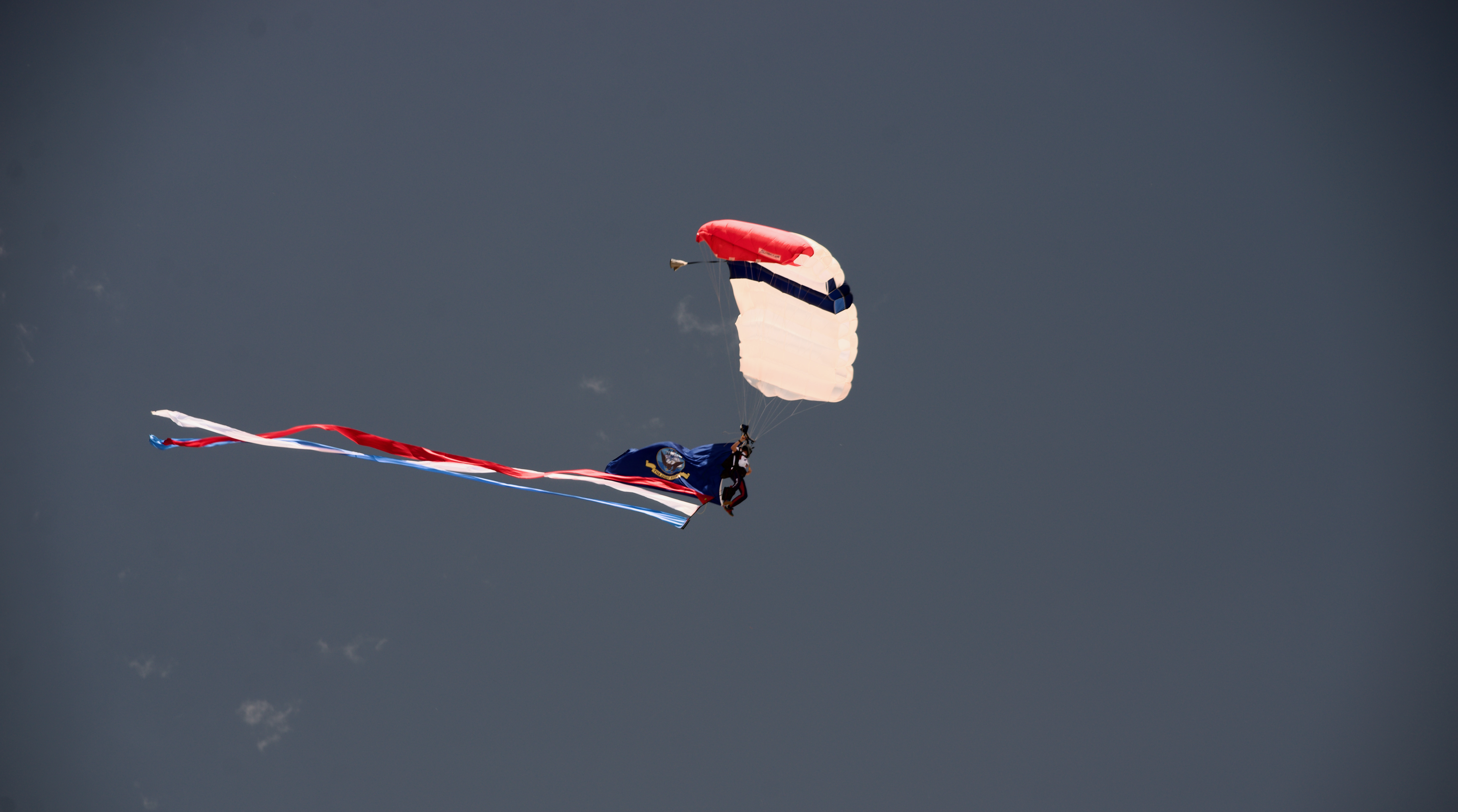 As part of Memorial Day celebrations in Boulder on May 27, 2024, a parachutist representing the United States Navy leapt from an airplane carrying the services flag. All six branches of the United States military, Air Force, Army, Navy, Marine Corps, Coast Guard and Space Force, were represented. (Alex Edwards/The Denver Gazette) (AlexanderEdwardsBusiness Reporteralex.edwards@gazette.comhttps://secure.gravatar.com/avatar/dbaa50cc8a9183e280c297e3afa72ace?d=mm&r=g)