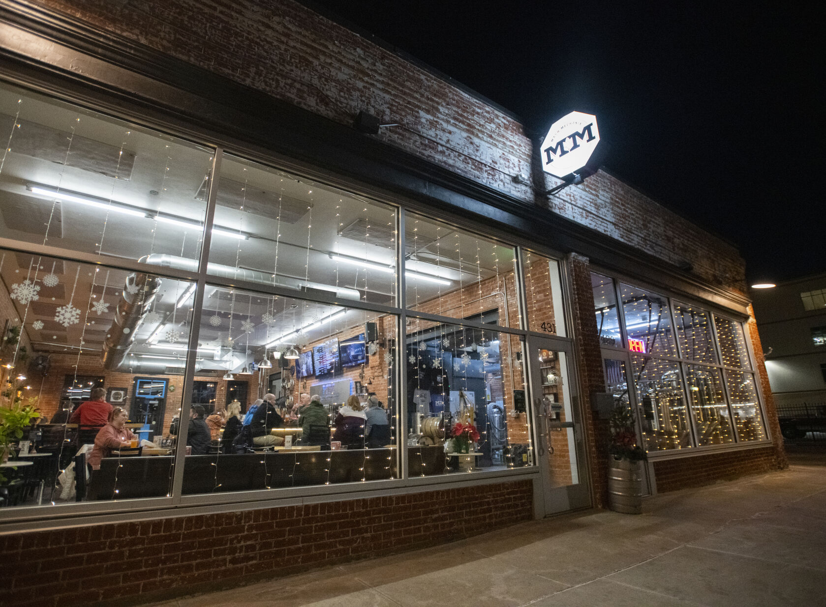 Patrons sit inside Mash Mechanix Brewing Company on a winter night Tuesday, Feb. 7, 2023, at the brewery on Pikes Peak Avenue in downtown Colorado Springs. Mash Mechanix features trivia on Mondays, food trucks and live music throughout the year.(The Gazette, Christian Murdock) (Mash Mechanix Brewing Co. Christian Murdock)