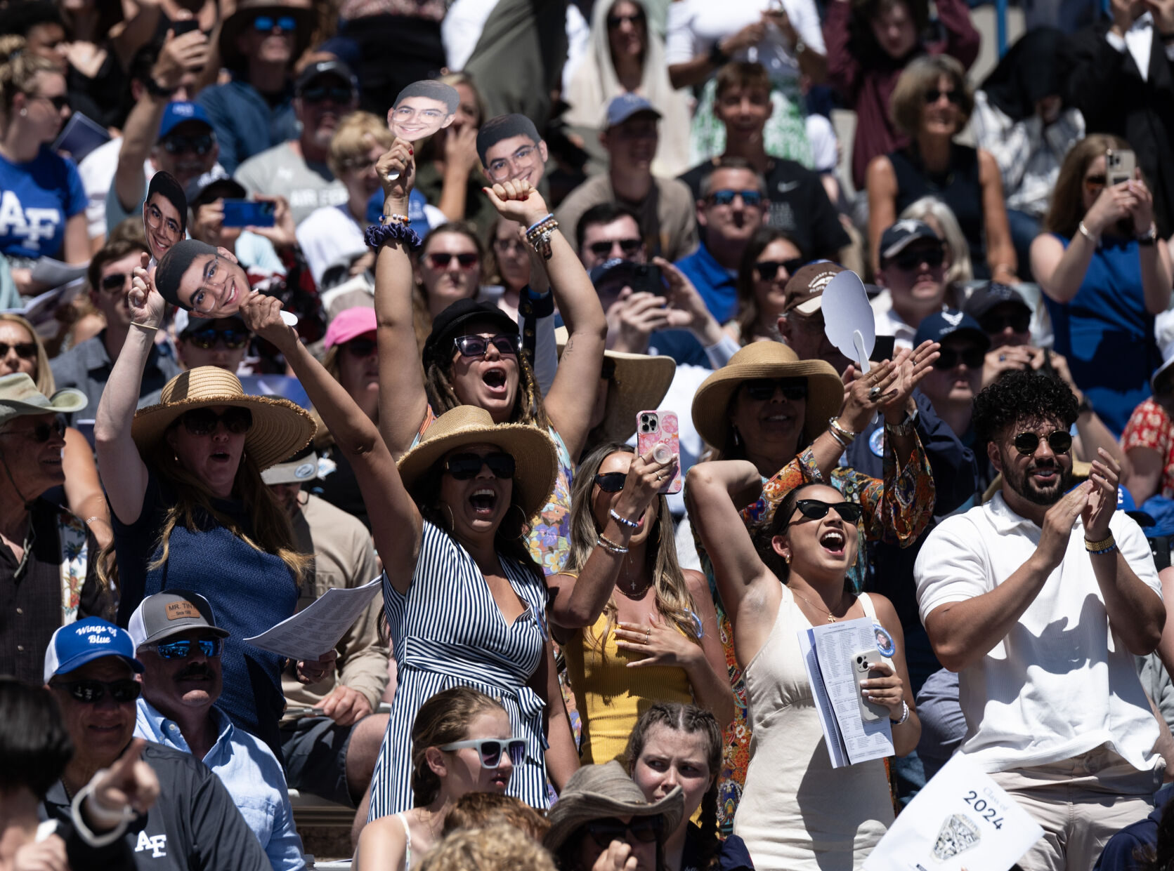 The family of a cadet cheers during the United States Air Force Academy graduation at Falcon Stadium on Thursday, May 30, 2024, in Colorado Springs, Colo. (Parker Seibold, The Gazette) (Parker Seibold)
